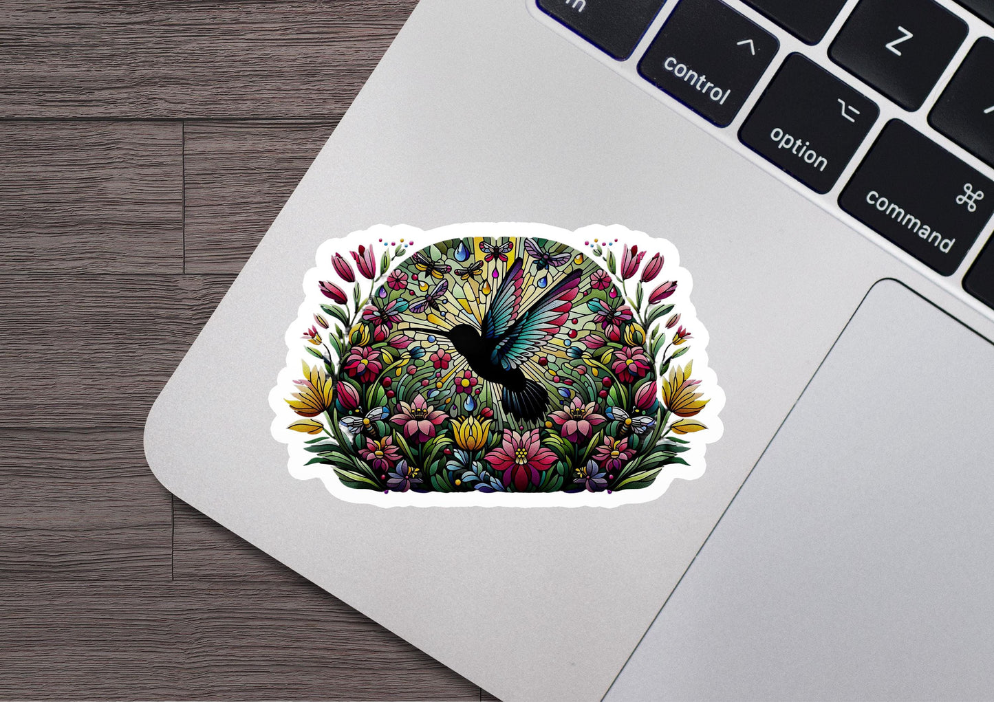 a laptop with a sticker of a bird on it