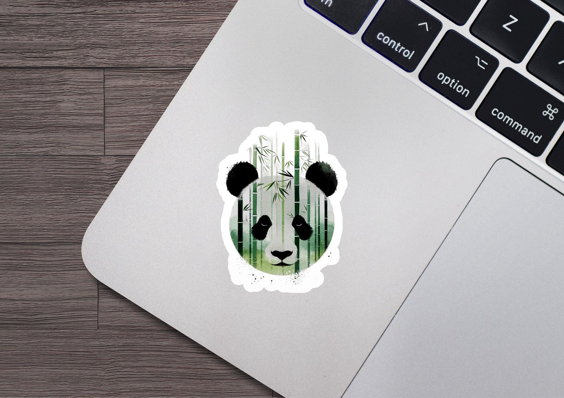 a panda bear sticker on a laptop