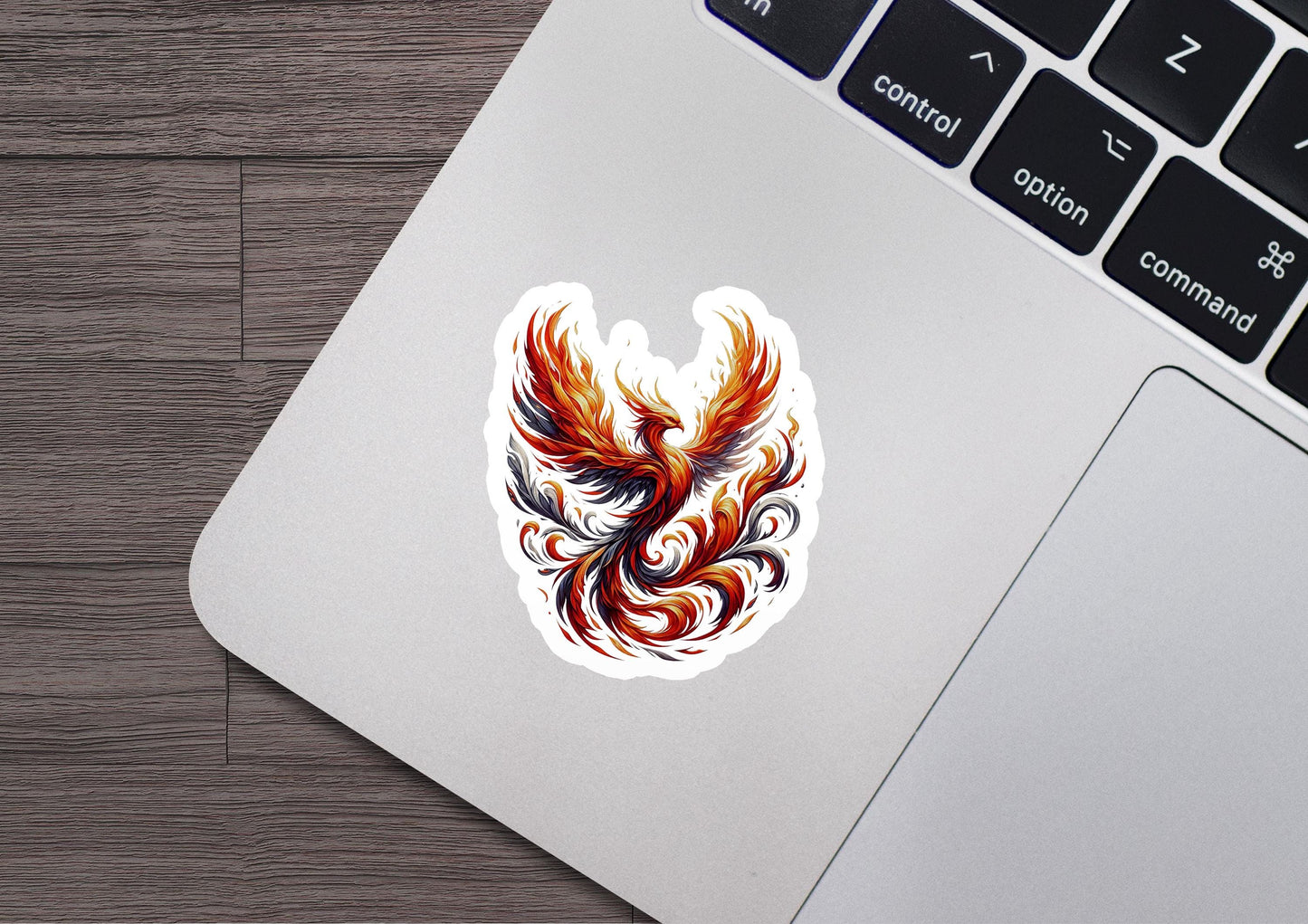 a laptop with a sticker of a bird on it