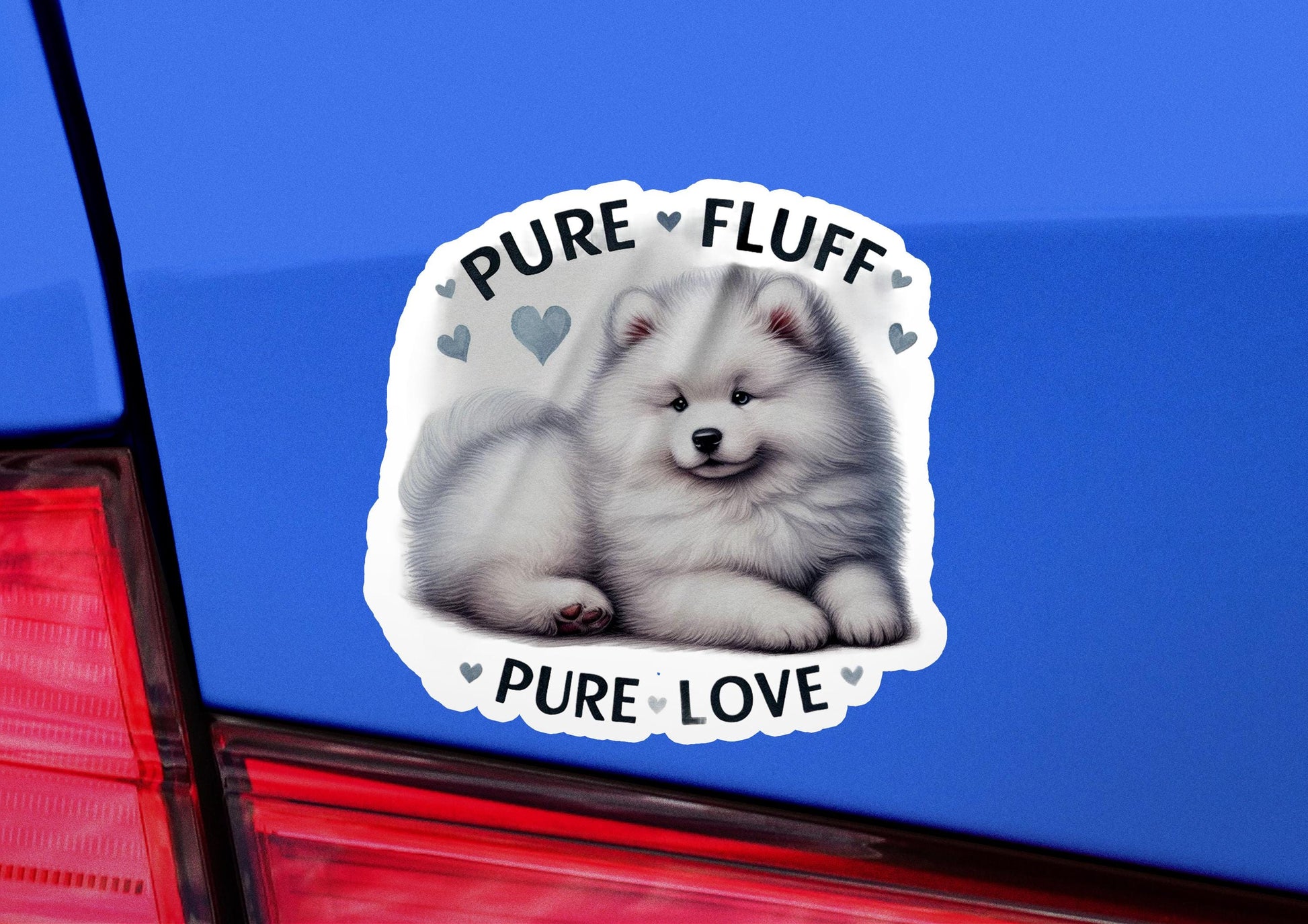 a sticker of a white fluffy dog on the back of a blue car