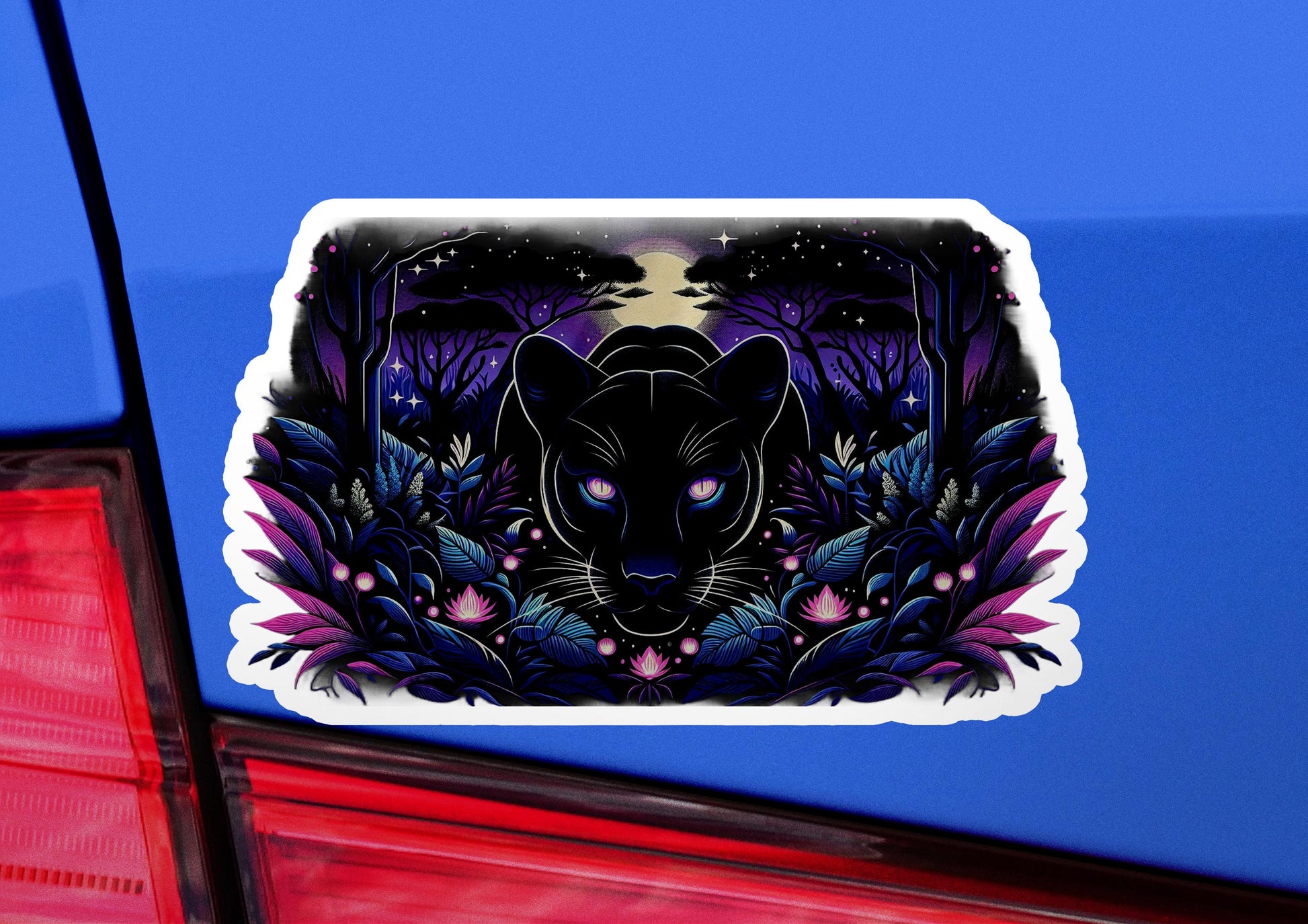 a sticker of a black cat on a car