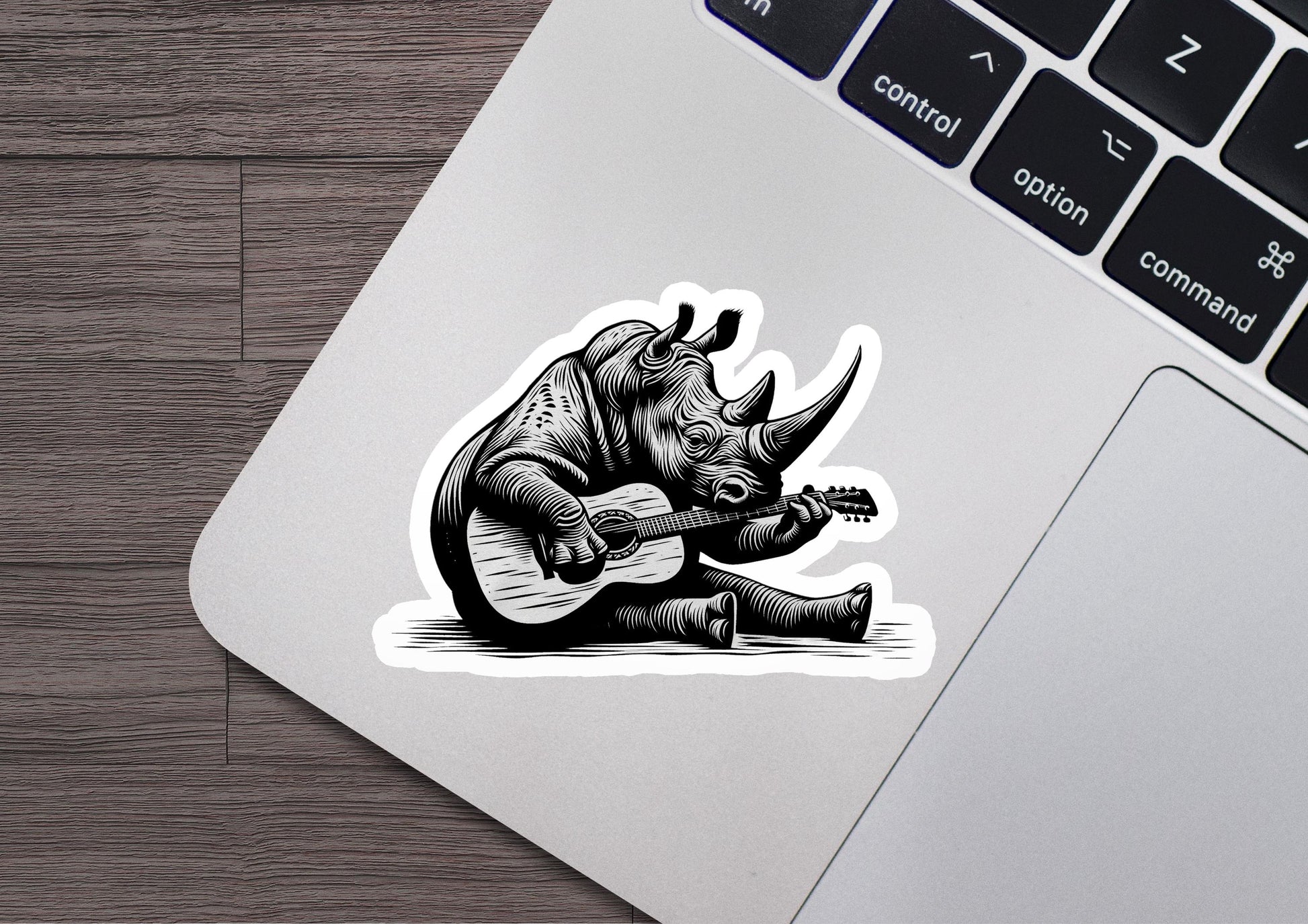 a sticker of a rhino playing a guitar