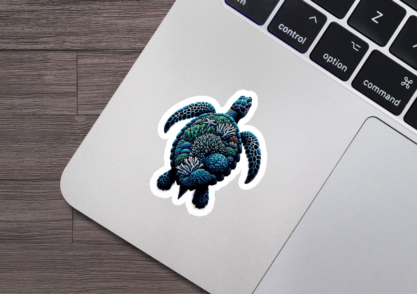 a sticker of a sea turtle on a laptop