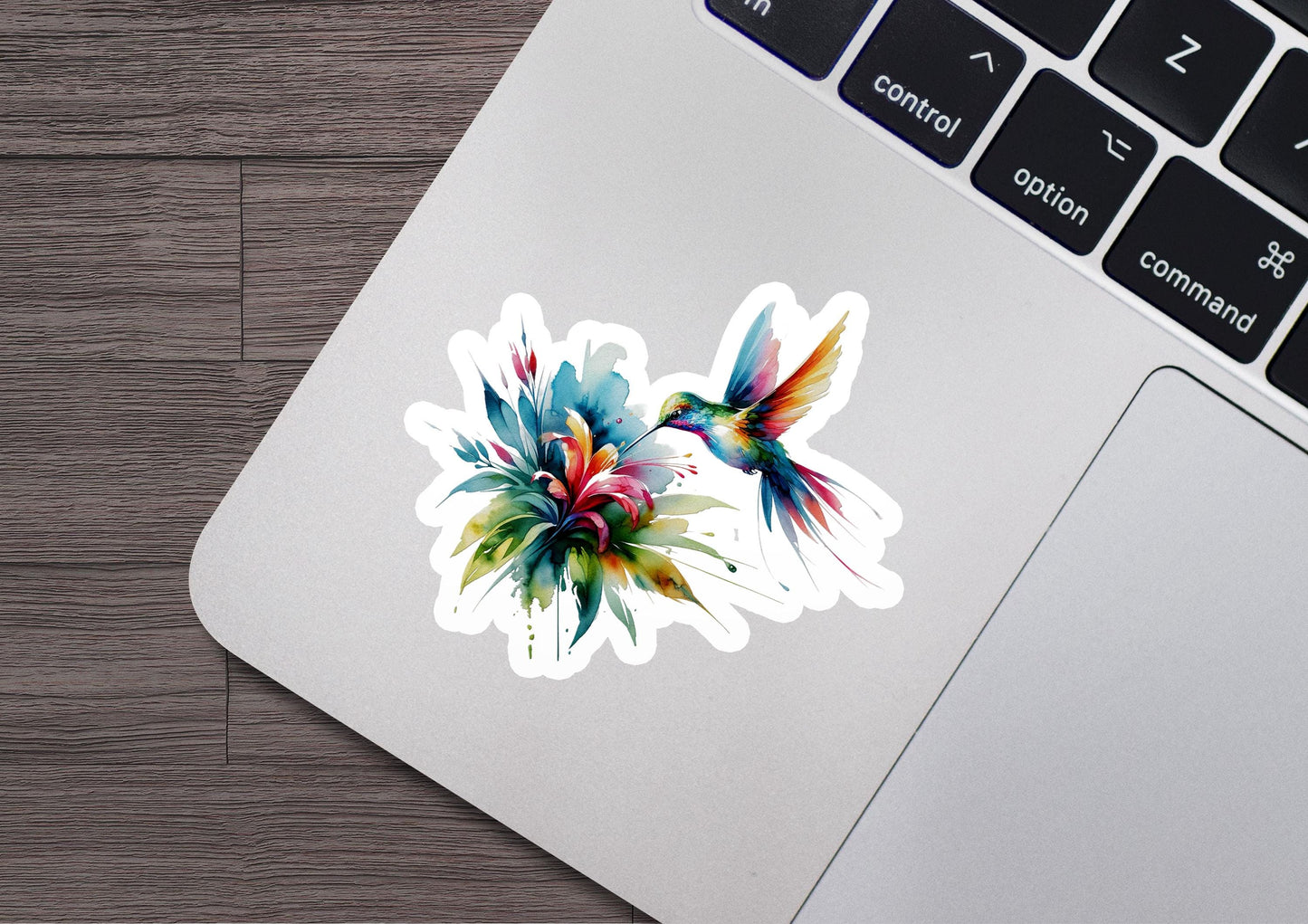 a laptop with a sticker of a bird on it