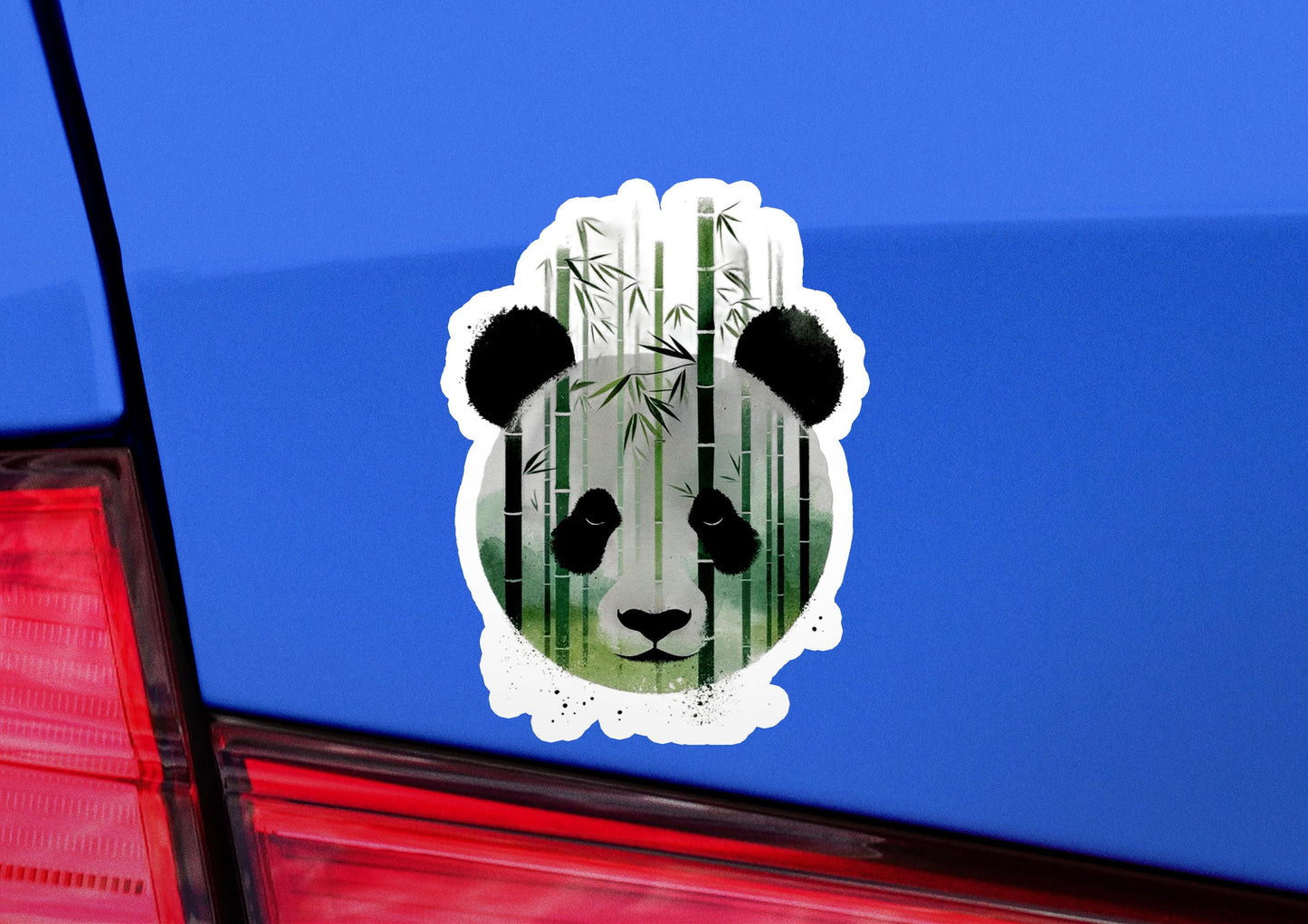 a panda bear sticker on the back of a car