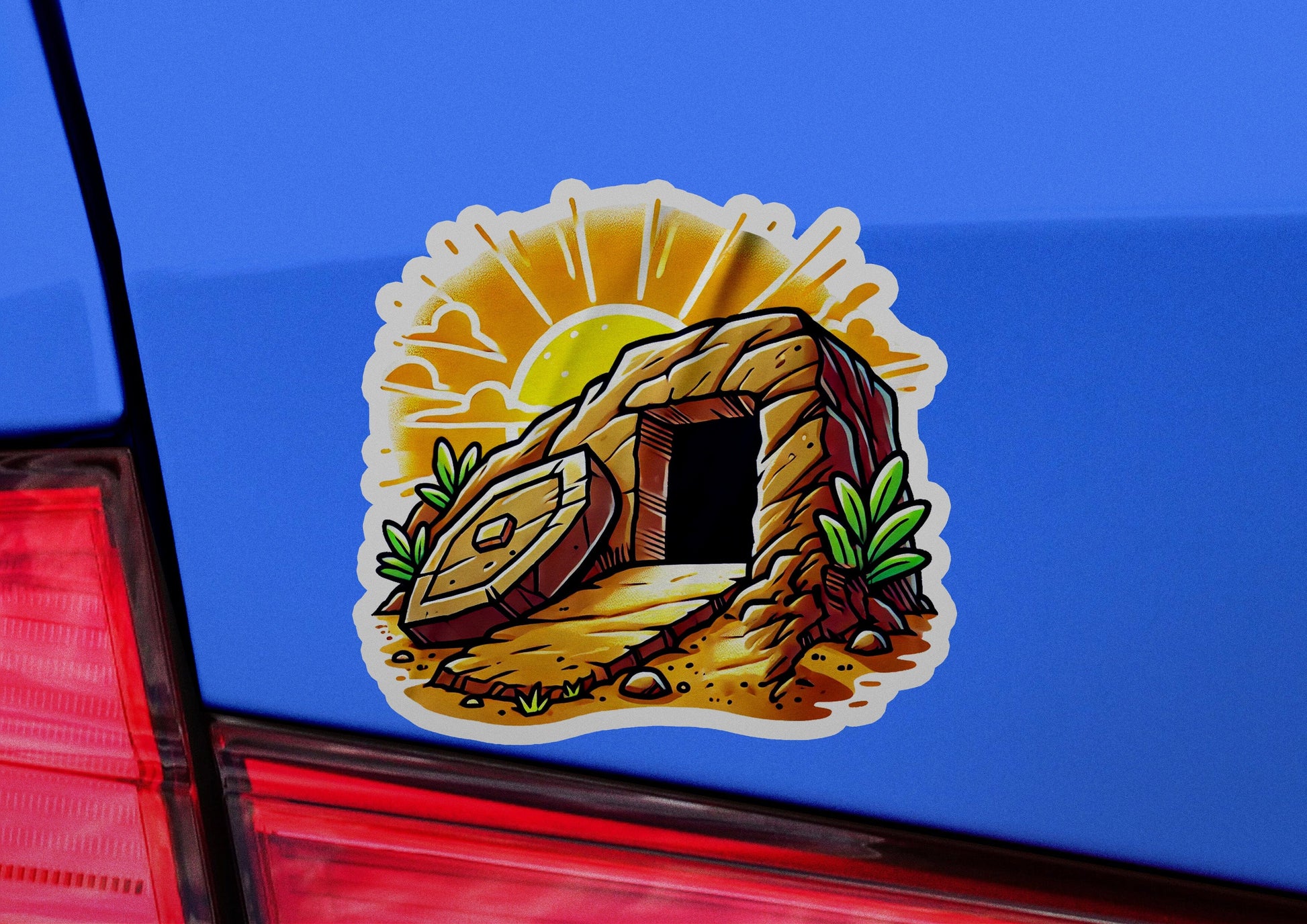 a sticker of a cave on the back of a car