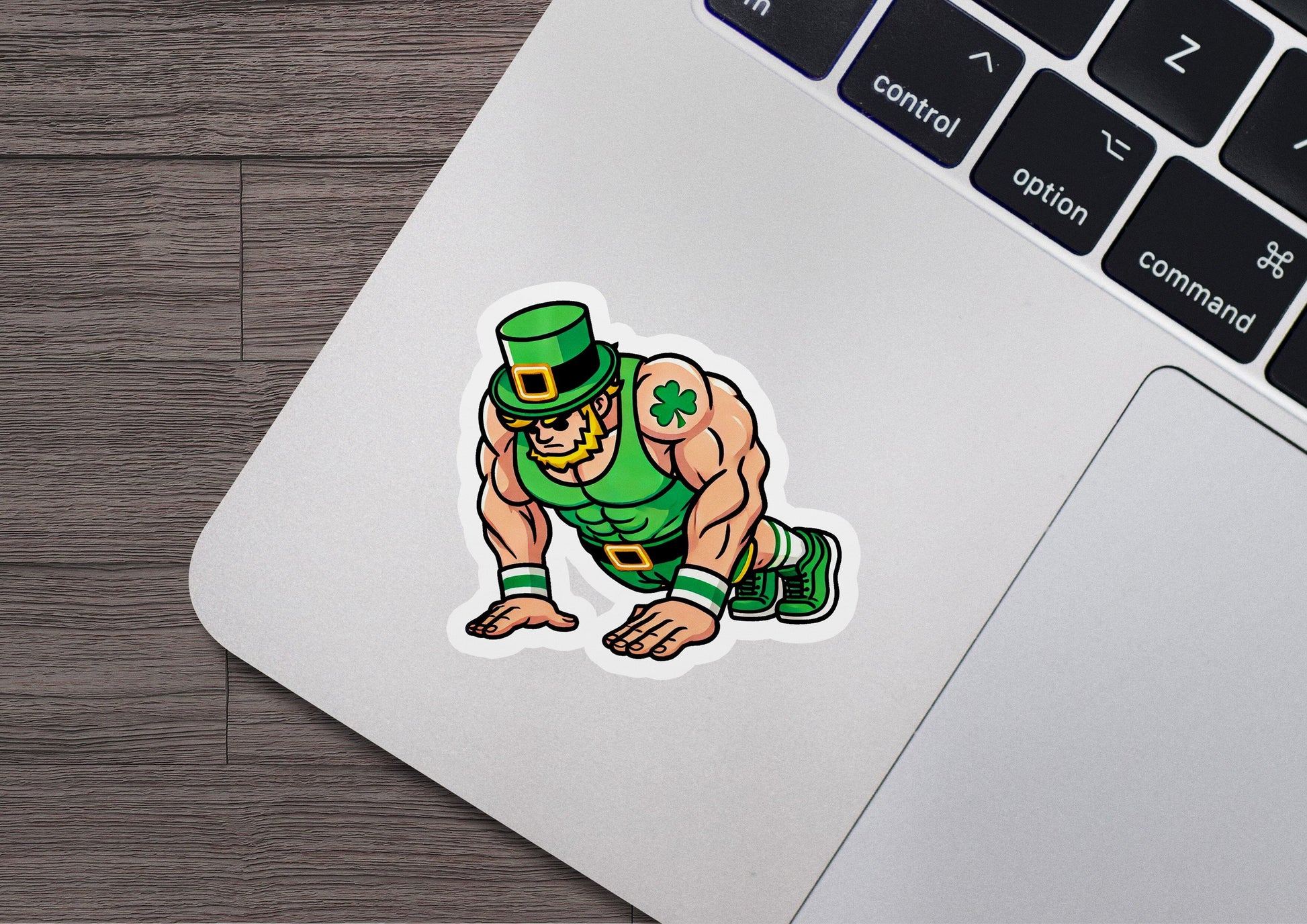 a laptop with a sticker of a wrestler