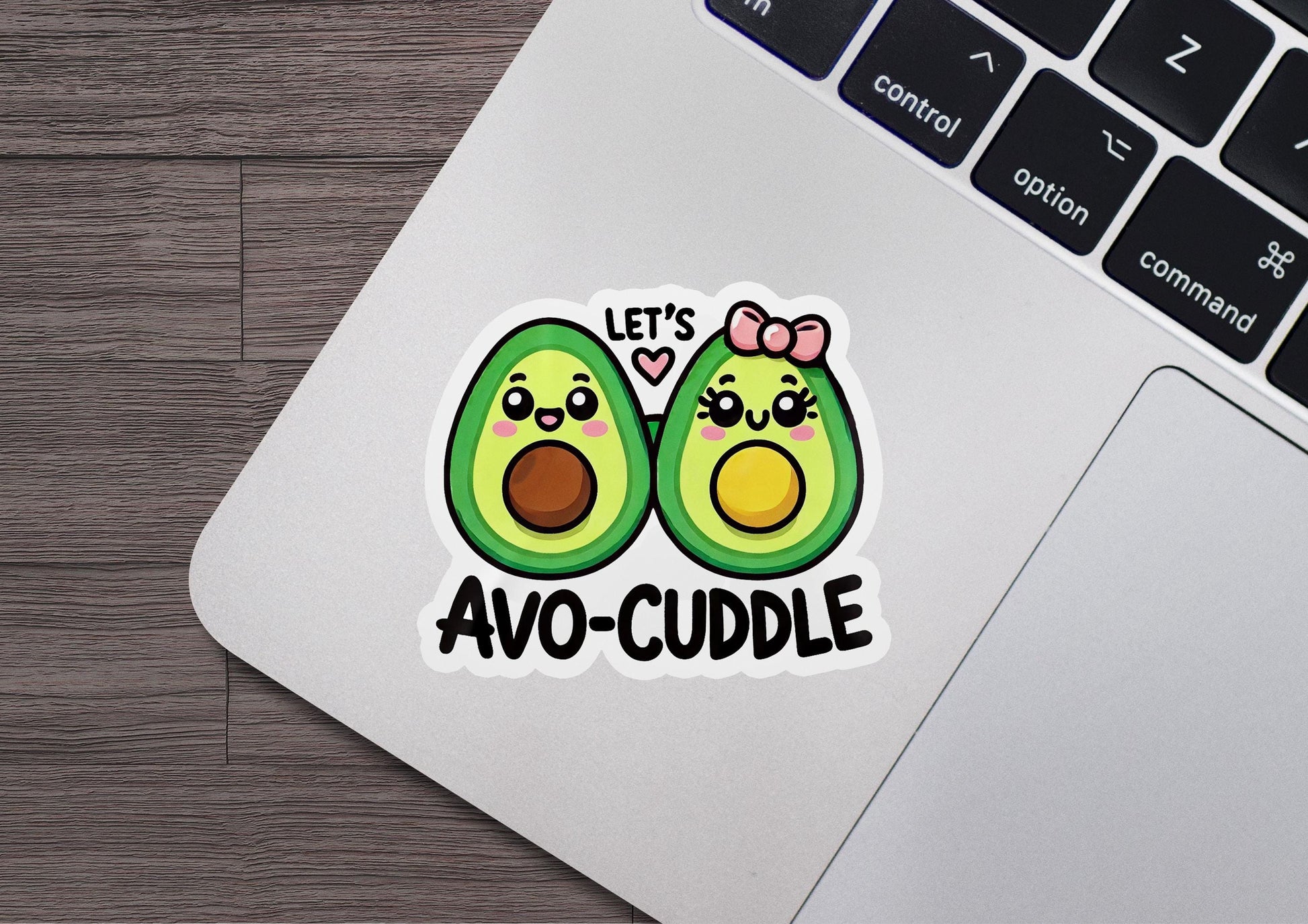 an avocado sticker on a laptop computer