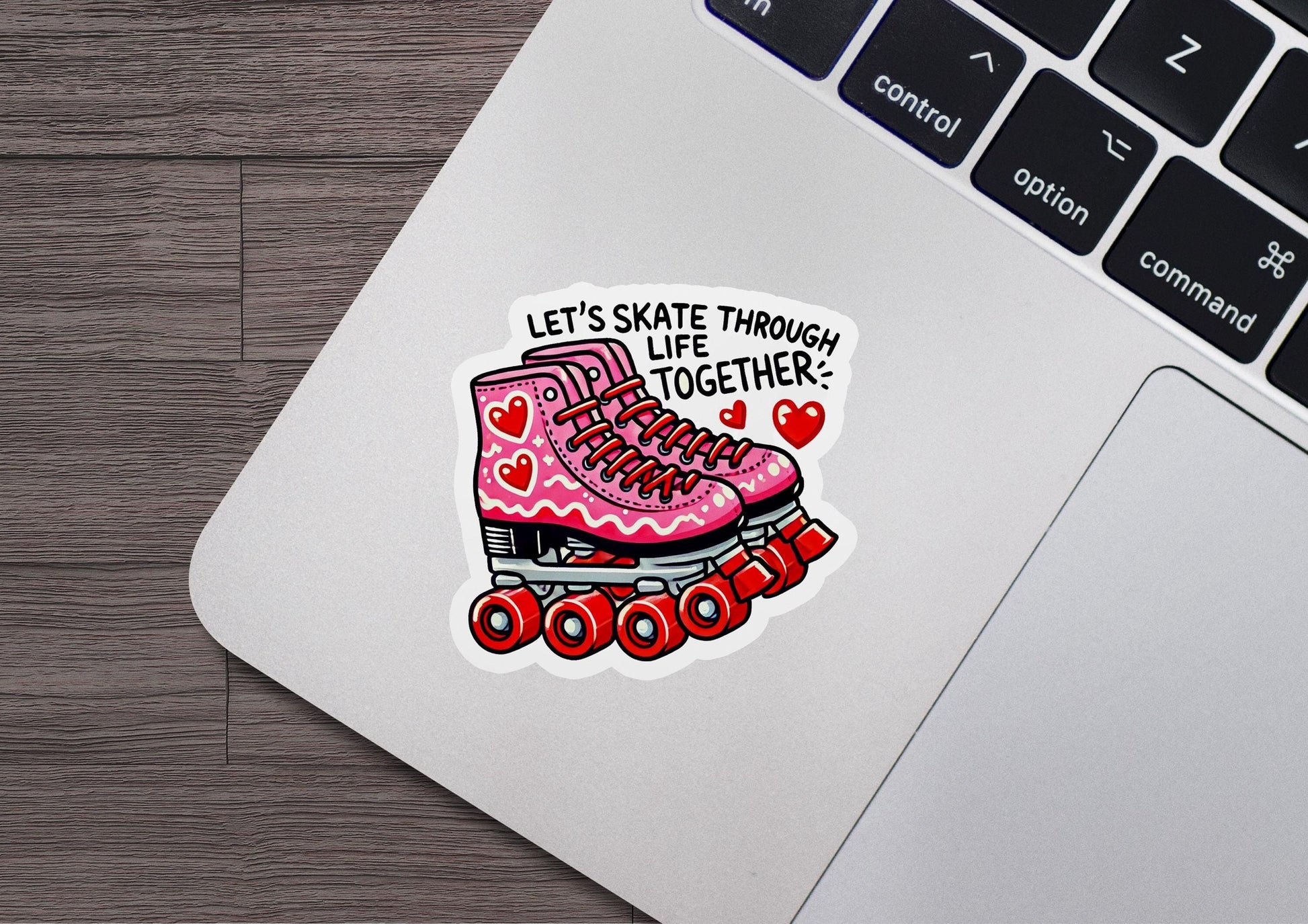 a laptop with a sticker of a pair of roller skates