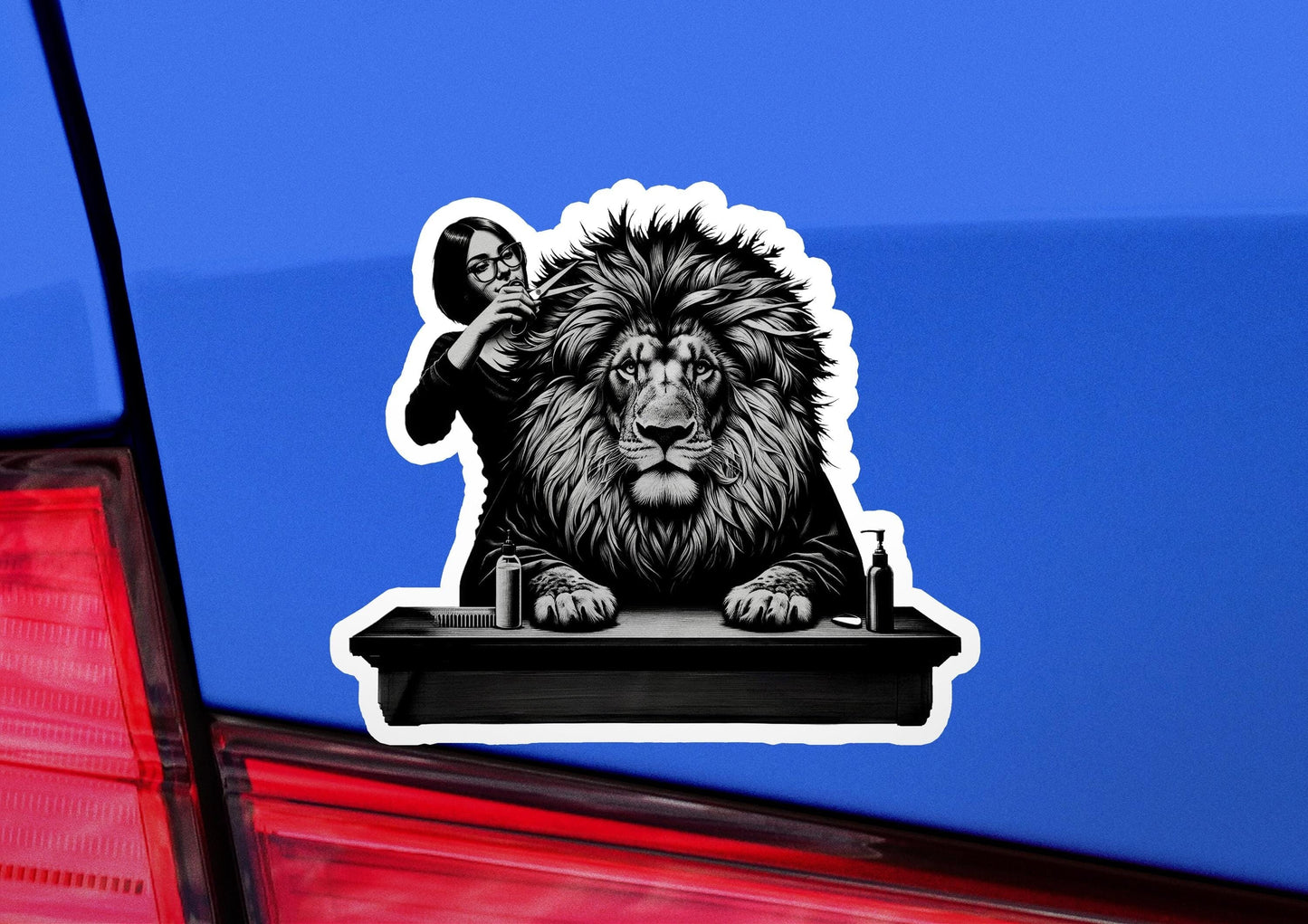 a sticker of a lion on the back of a car