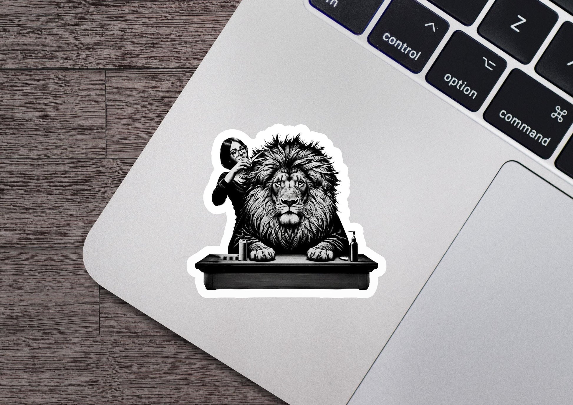 a sticker of a lion sitting on top of a laptop
