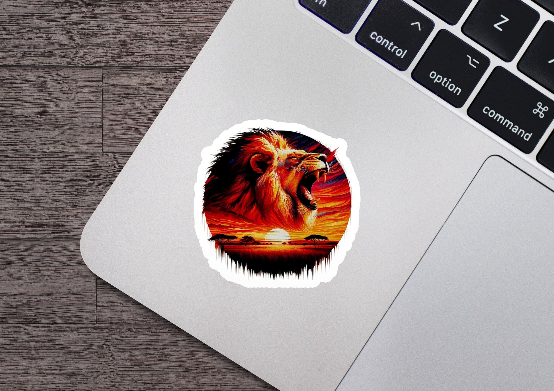 a lion sticker on a laptop keyboard