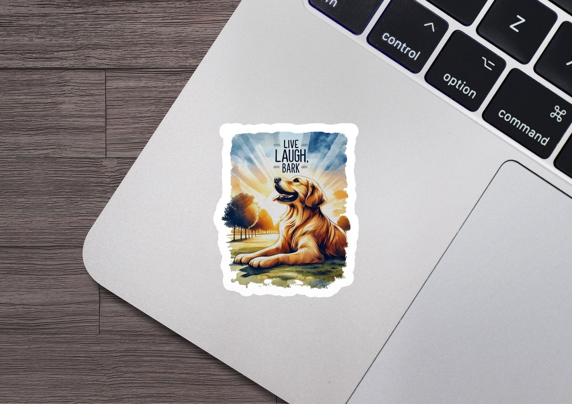 a sticker of a dog sitting on top of a laptop