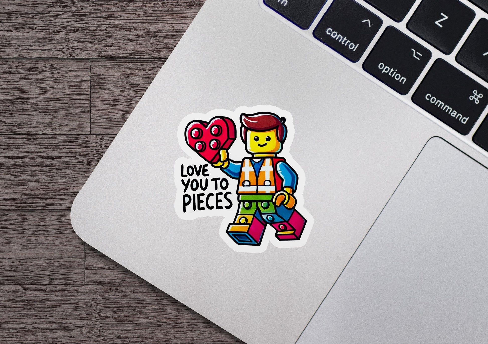 a laptop with a sticker of a lego character