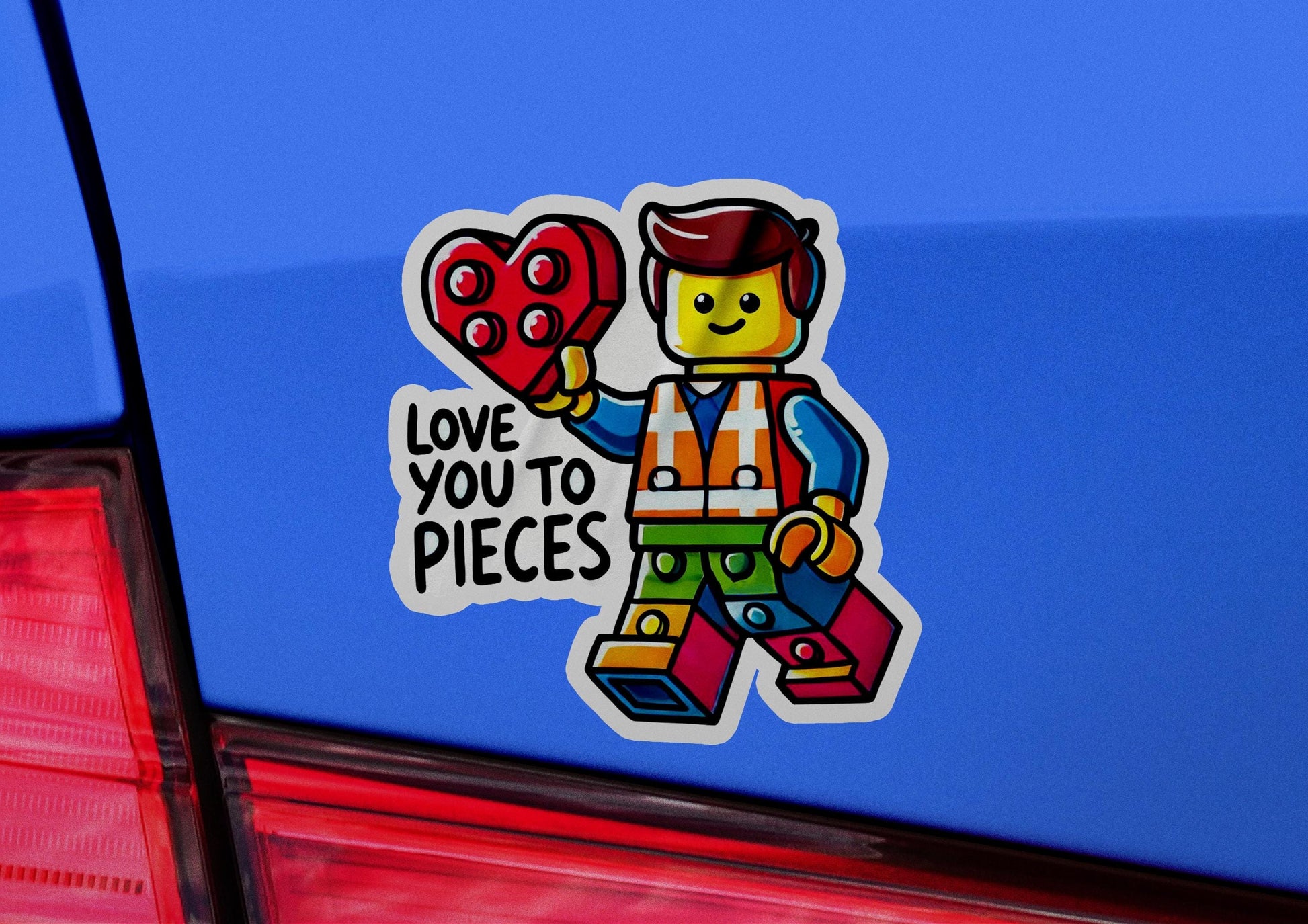 a sticker of a lego man holding a heart