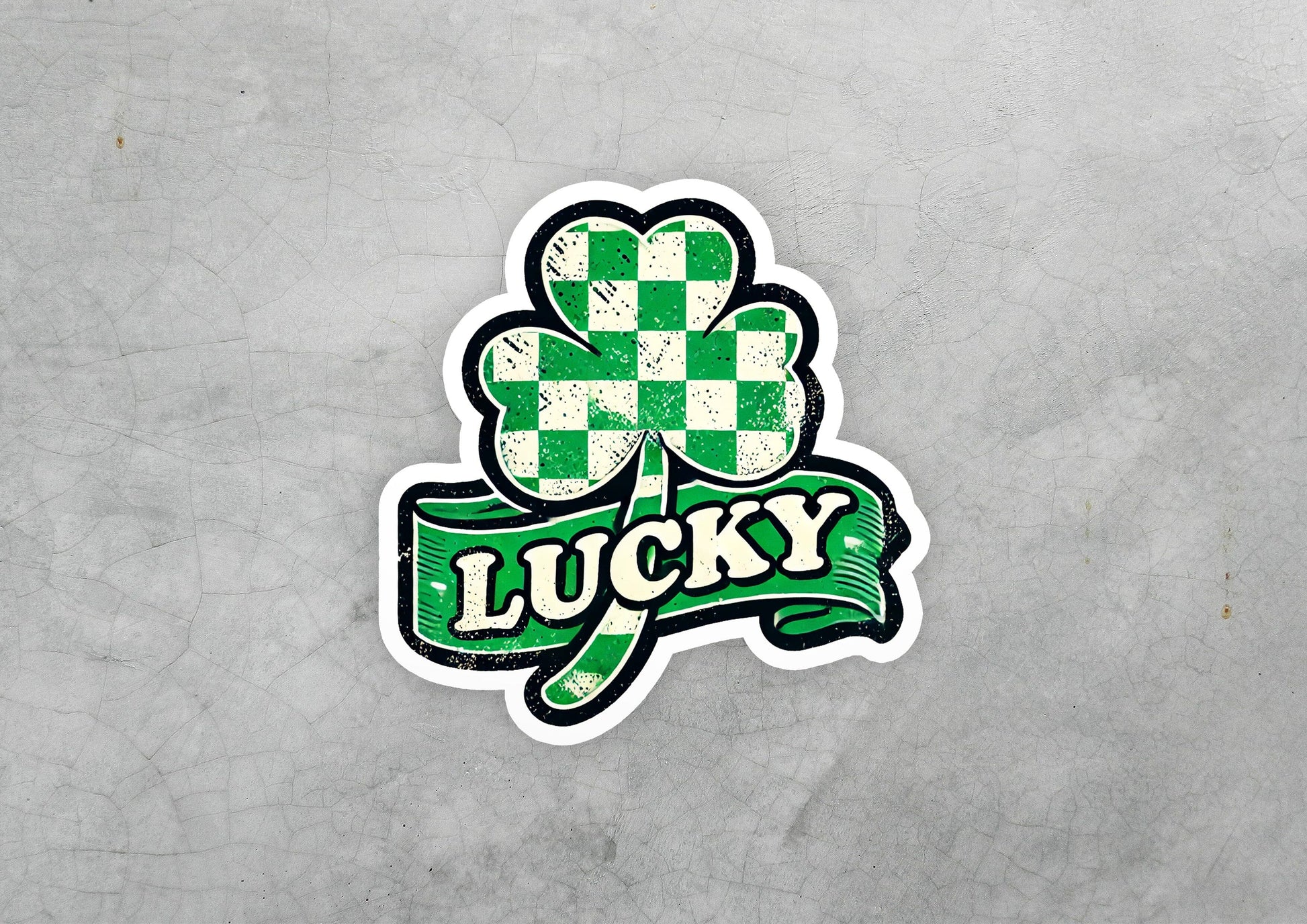 a sticker of a clover with the word lucky on it