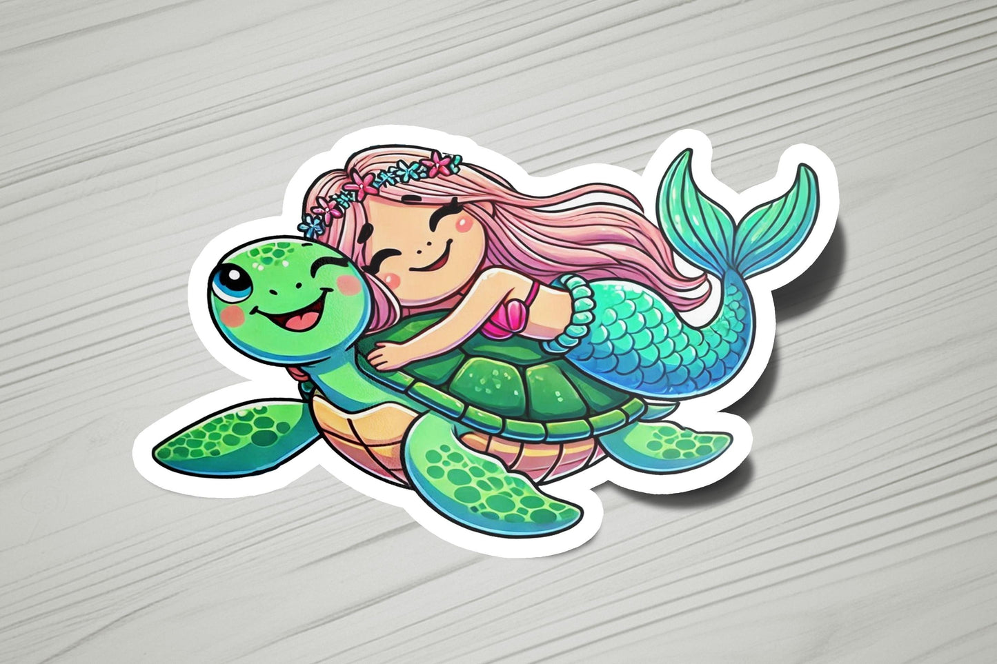 a sticker of a mermaid riding a turtle