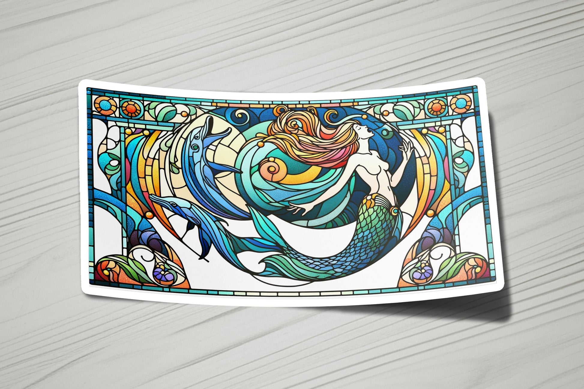 a sticker with a picture of a mermaid on it