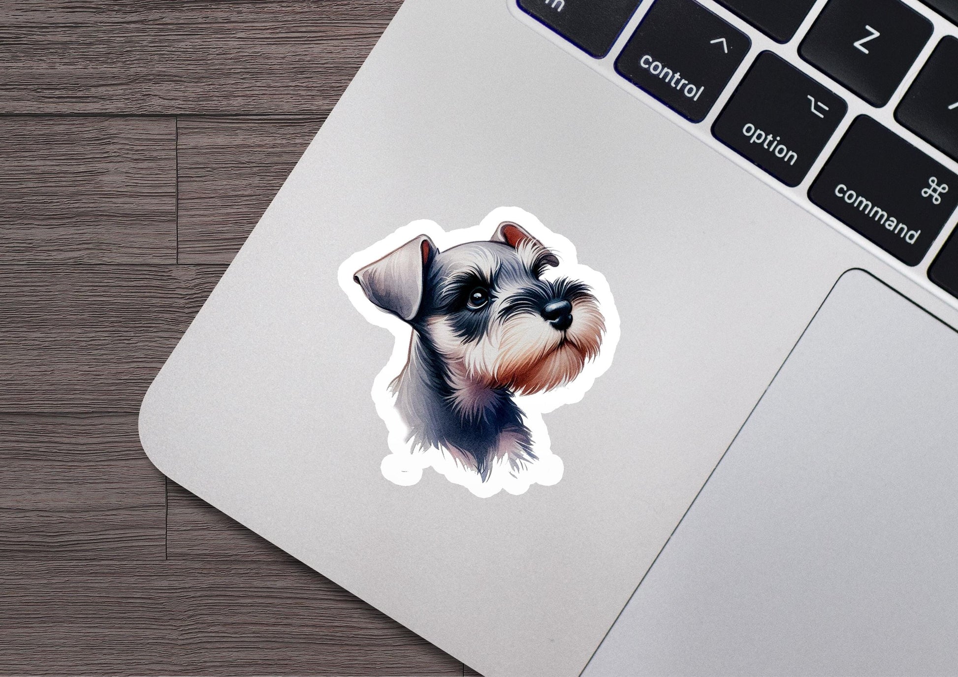 a laptop with a sticker of a dog on it