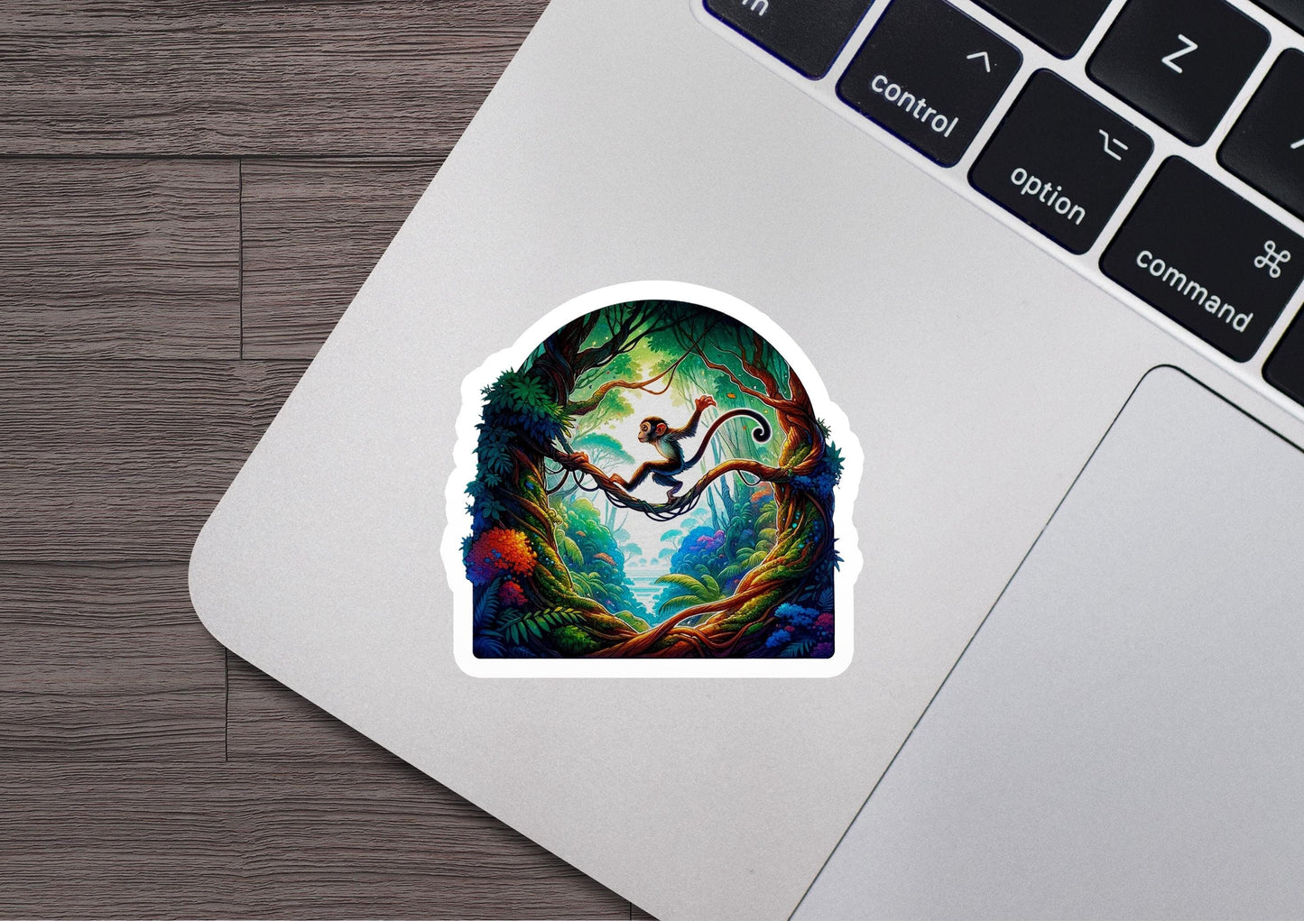 a laptop with a sticker of a tree with a bird on it