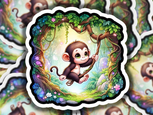 a sticker of a monkey hanging from a tree