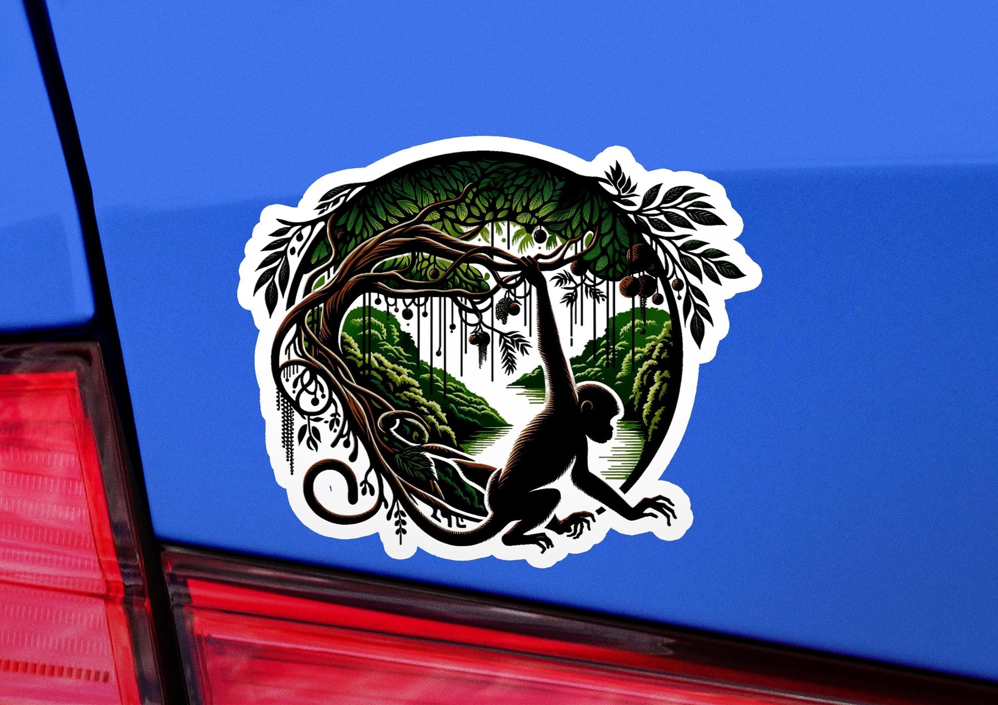 a sticker of a monkey hanging from a tree
