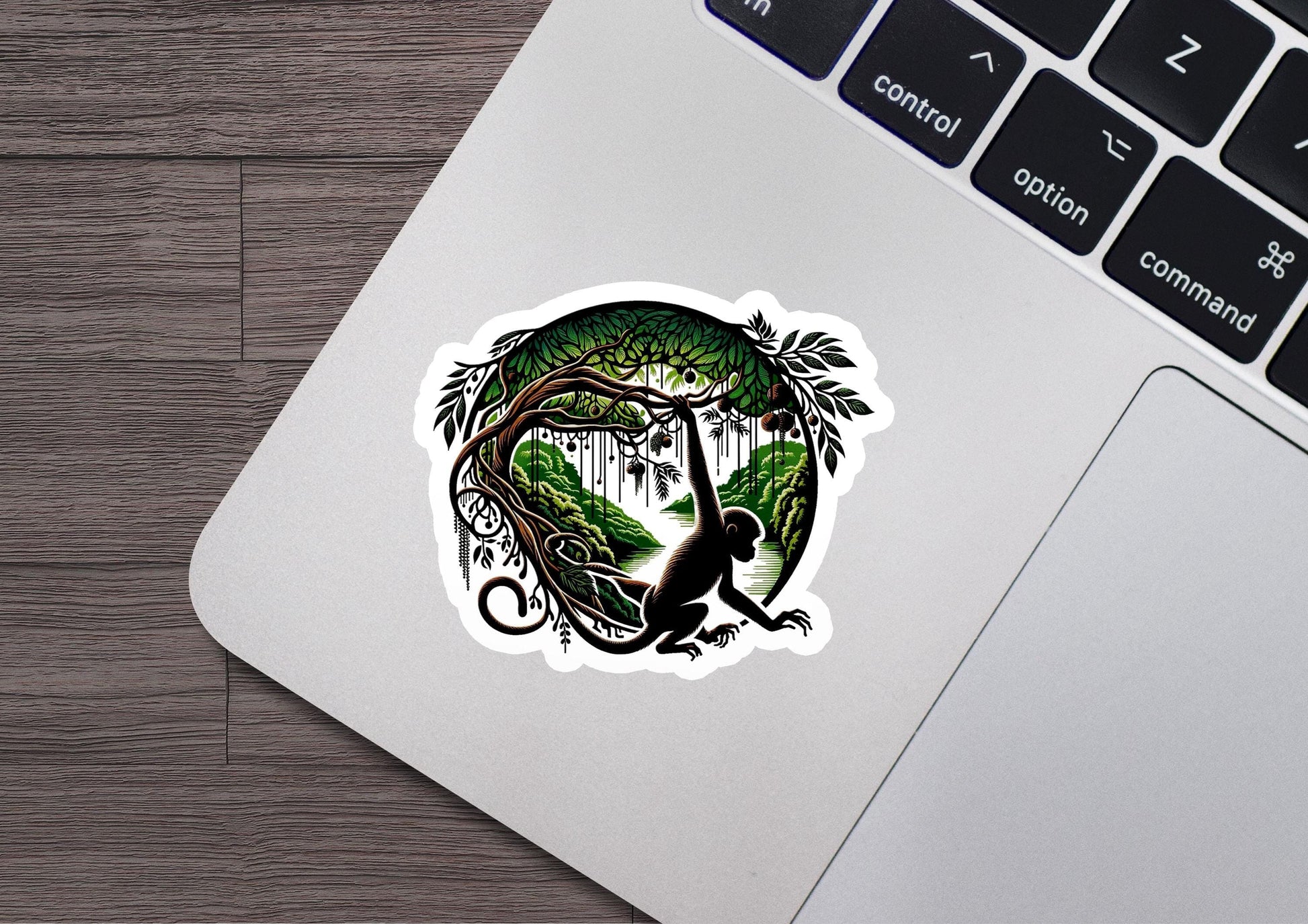 a laptop with a sticker of a monkey on it