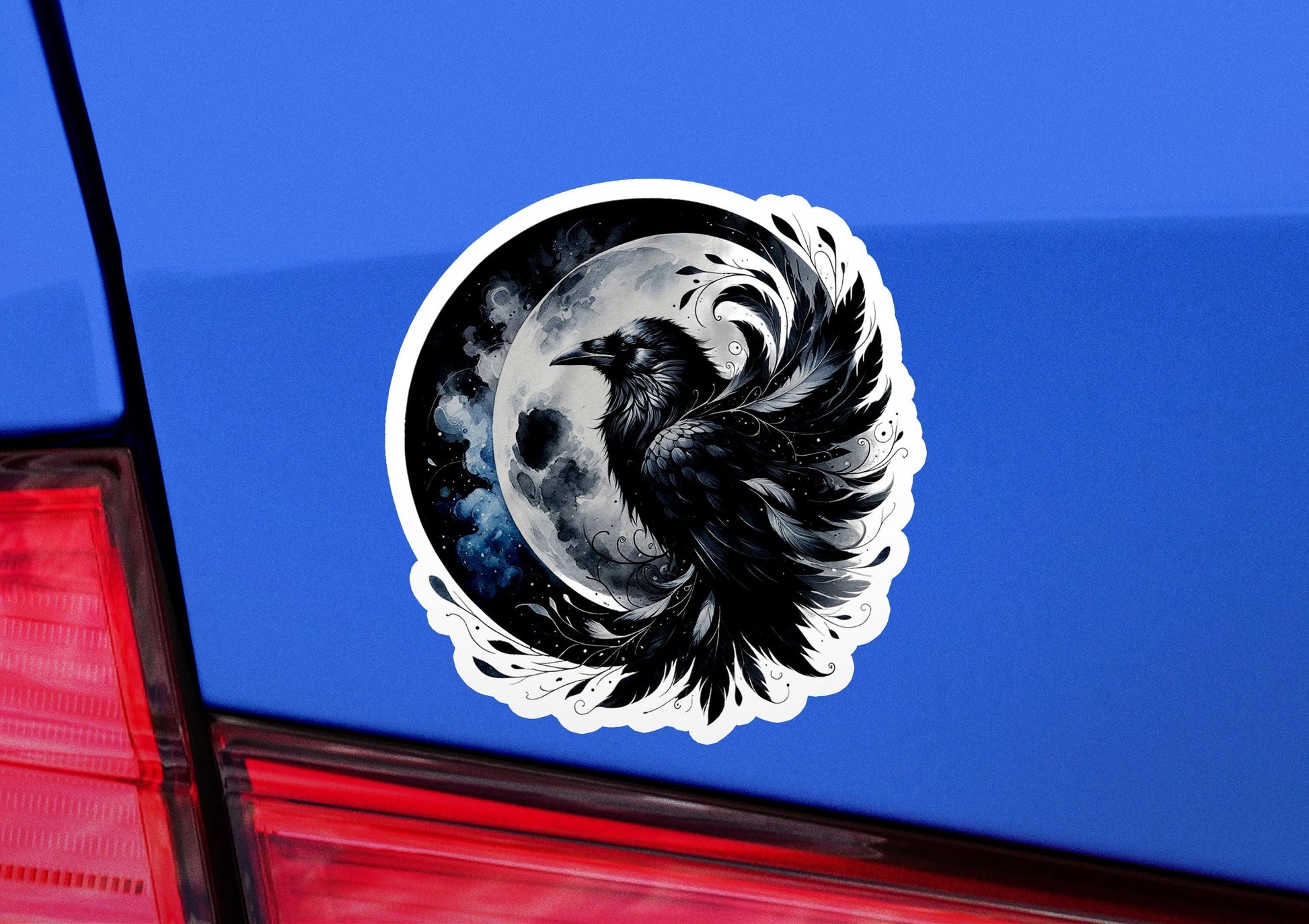 a sticker of a black bird on a blue car