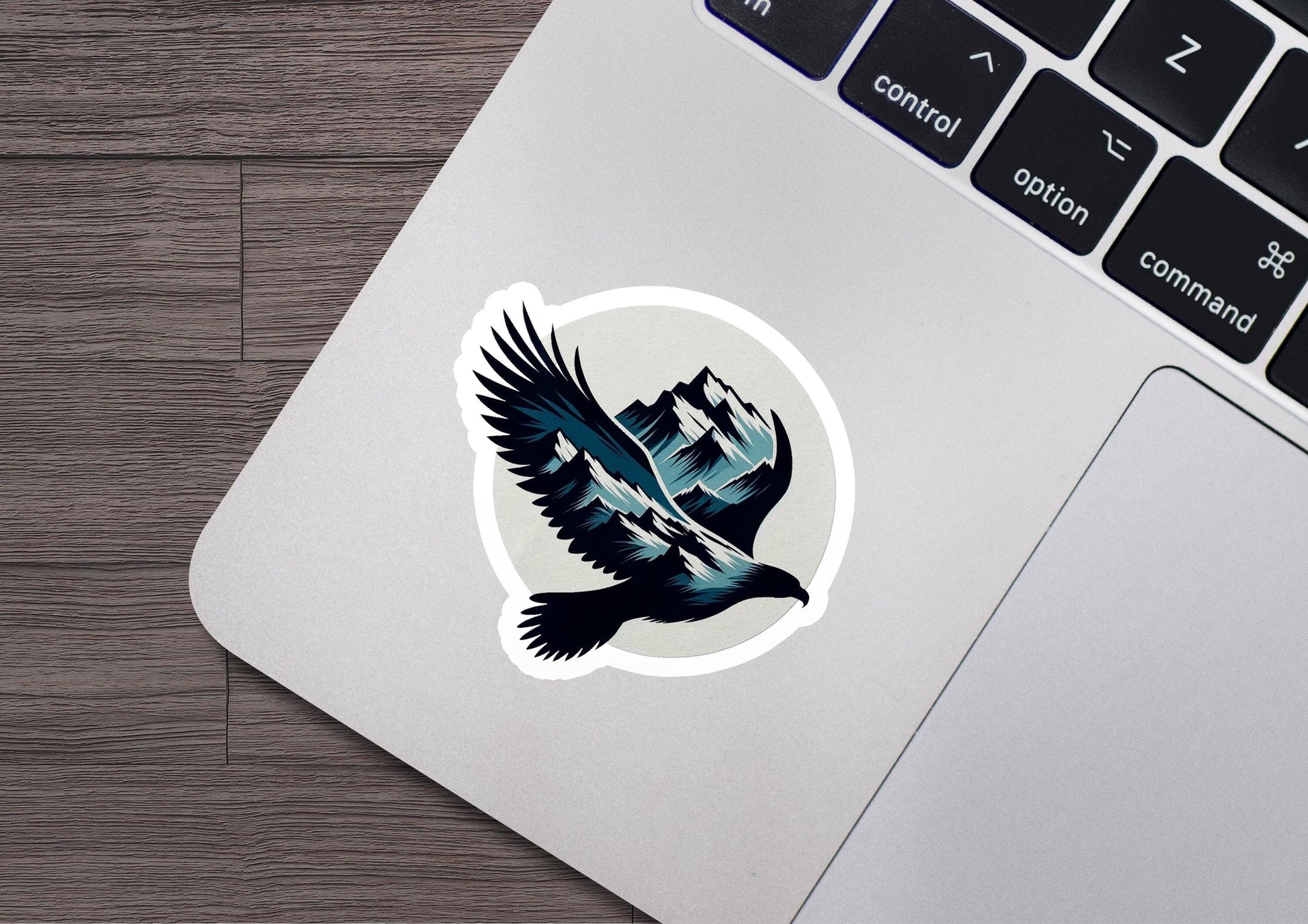 a laptop with a sticker of a bird on it