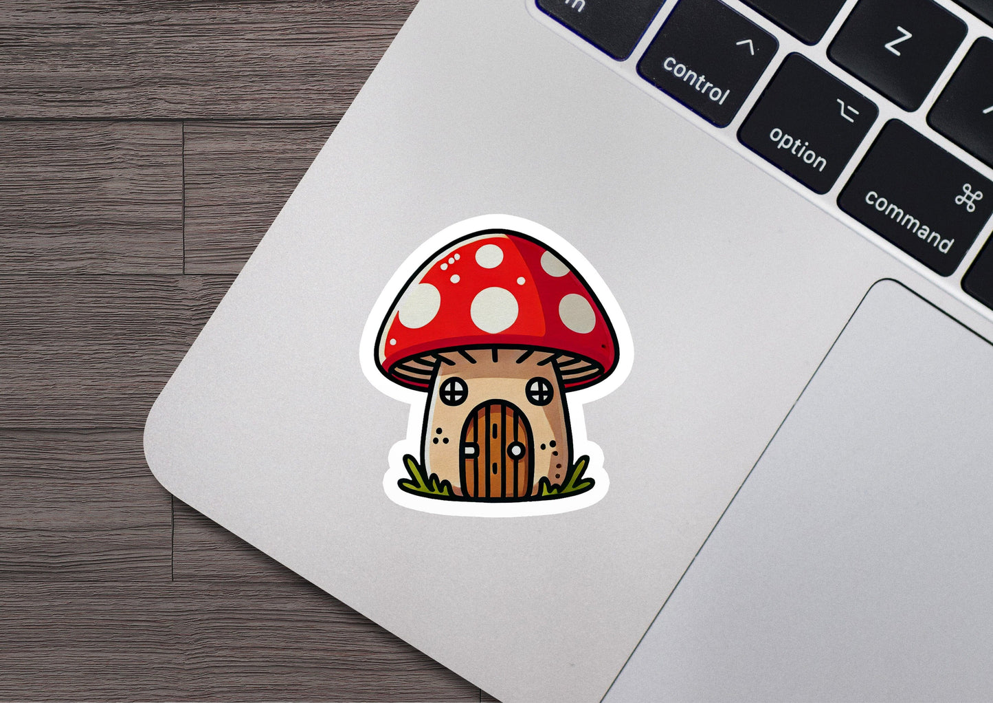 a laptop with a sticker of a mushroom on it