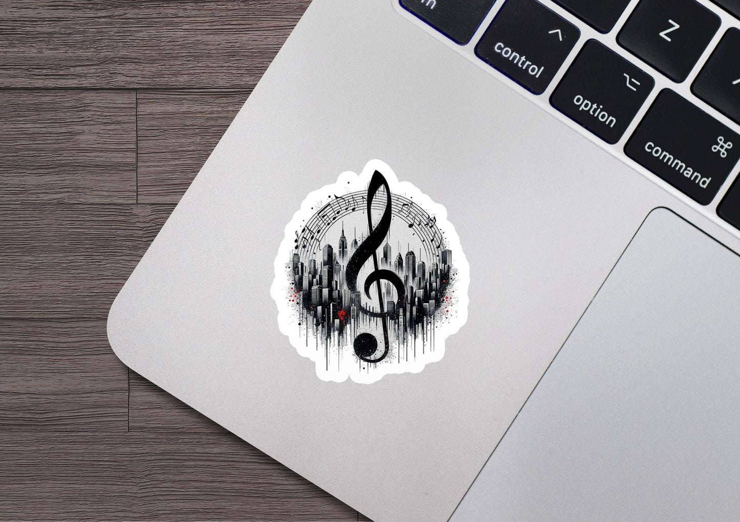 a musical note sticker on a laptop keyboard