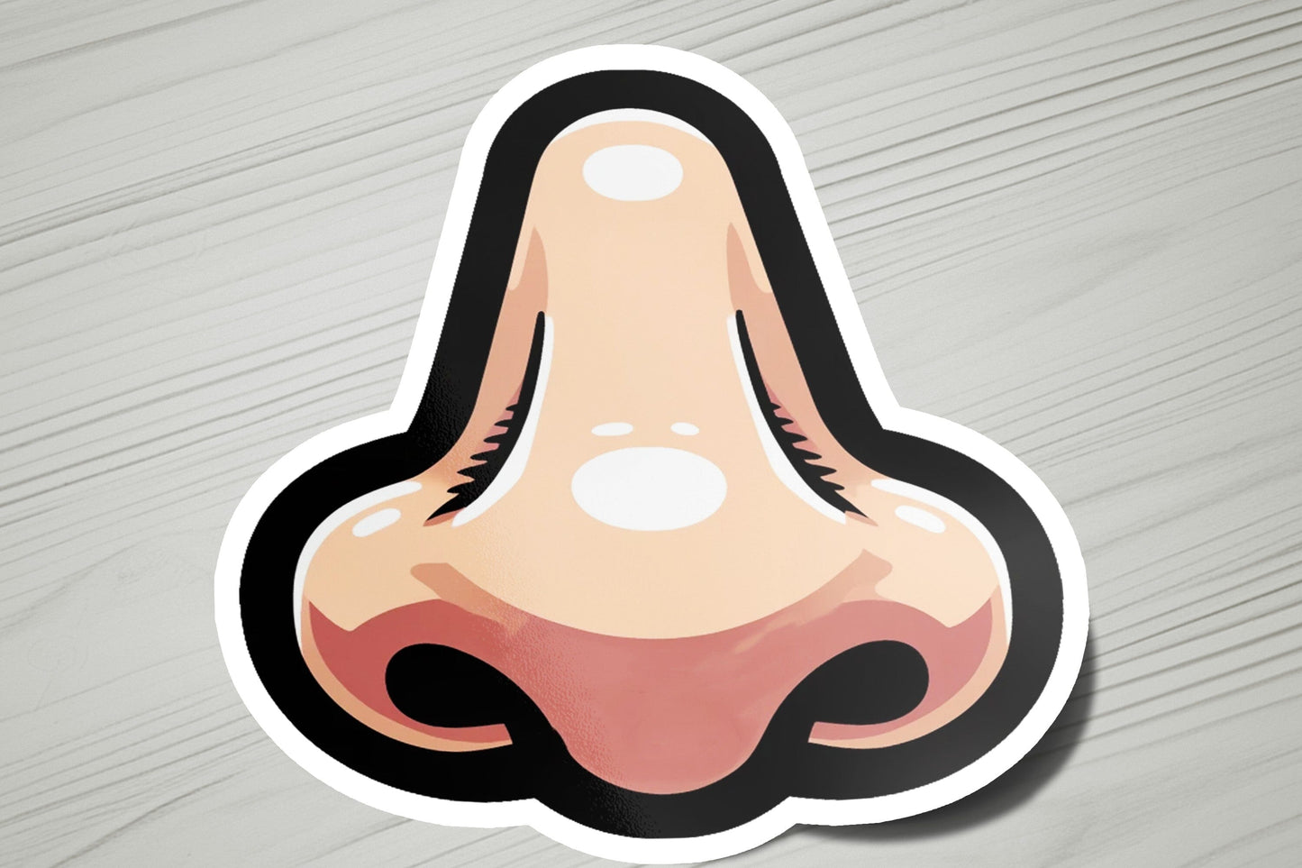 a sticker of a nose on a wooden surface