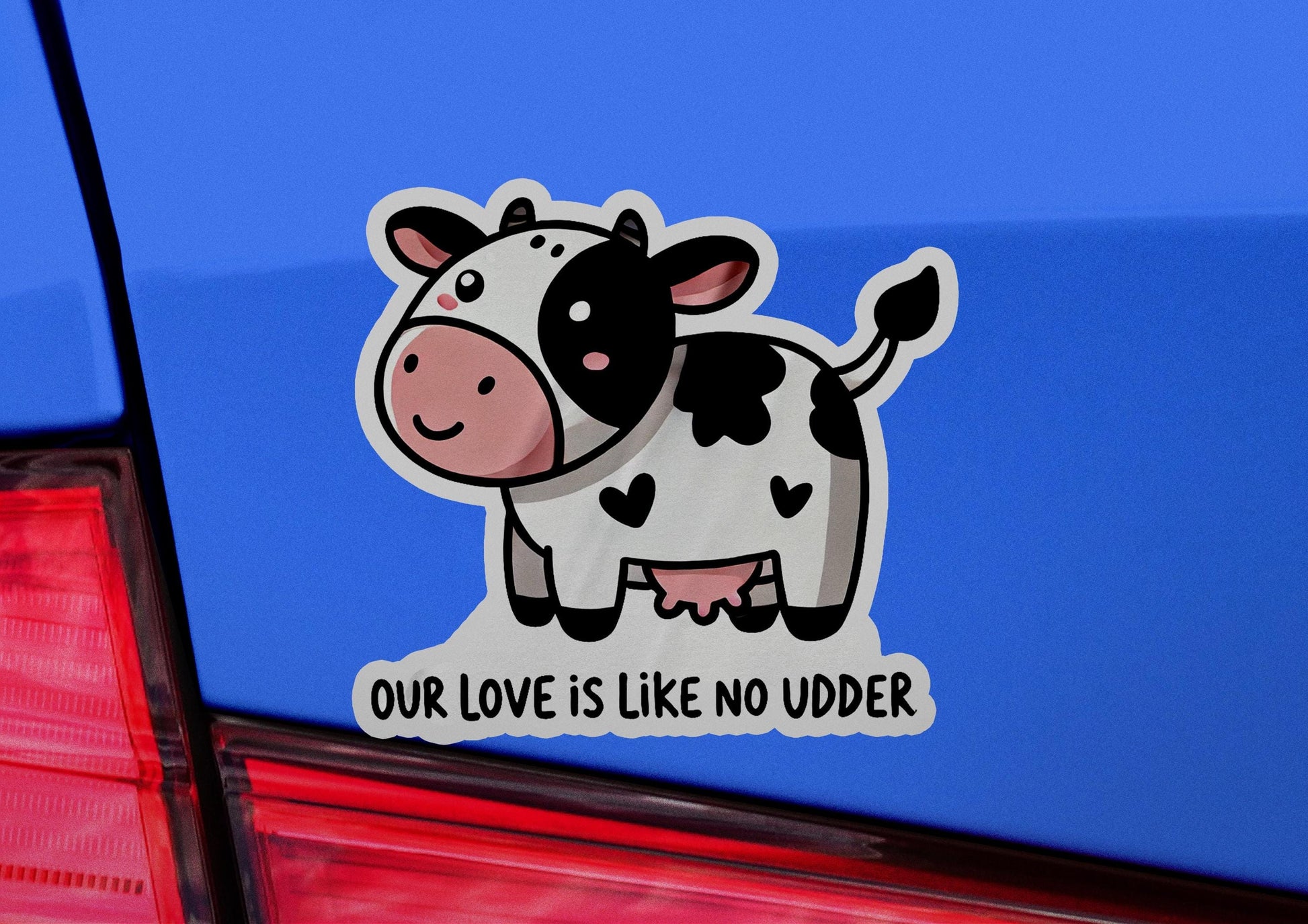 a sticker of a cow that says our love is like no udder