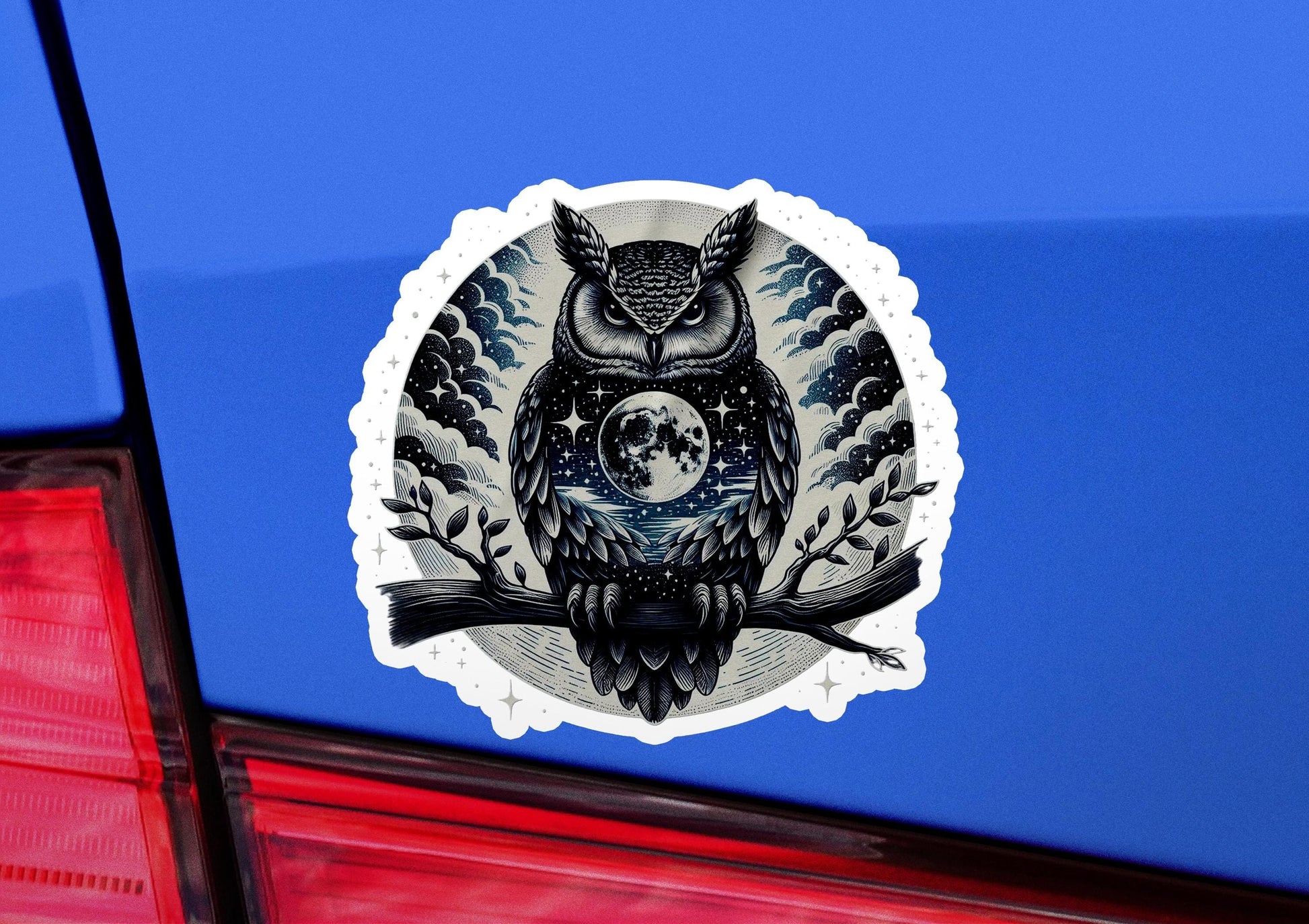 an owl sticker on the back of a car