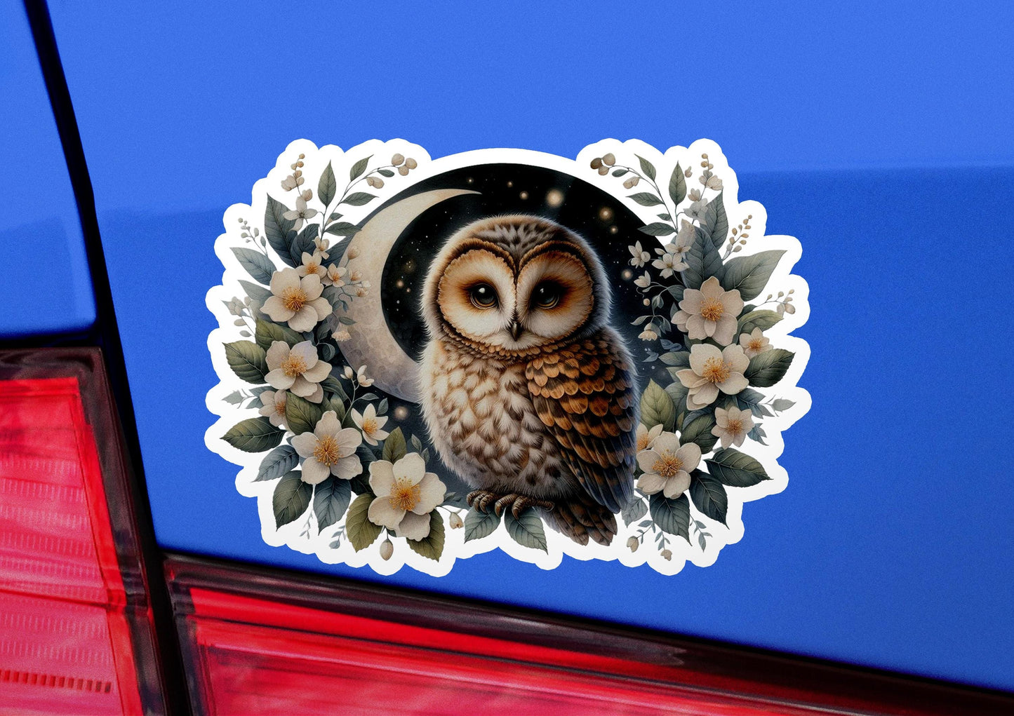 an owl sticker on the back of a car
