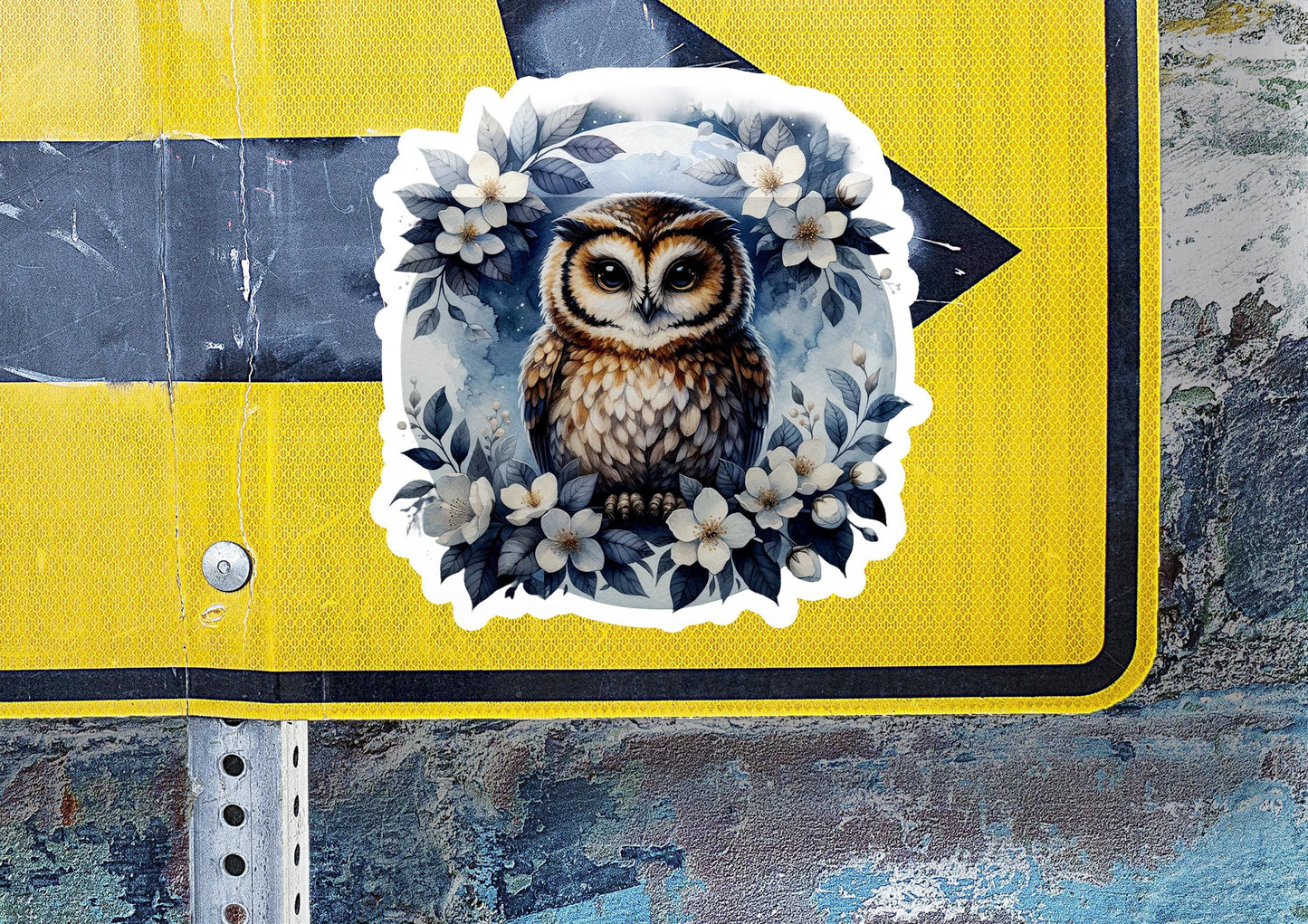 a sticker of an owl with flowers on it