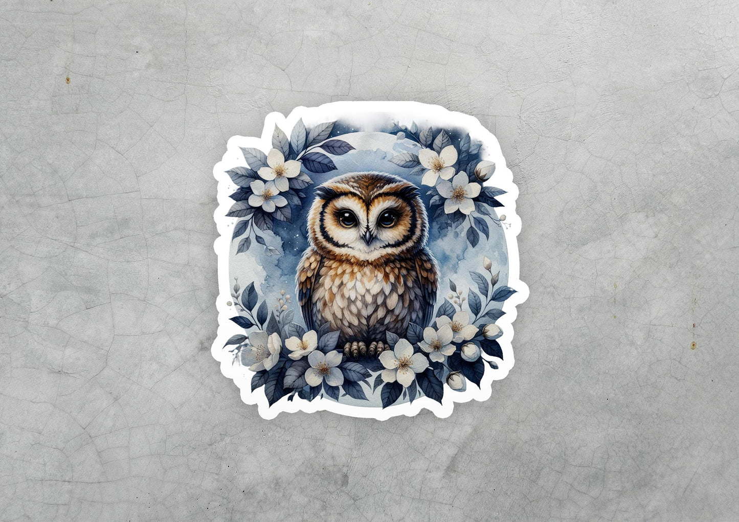 a sticker of an owl surrounded by flowers
