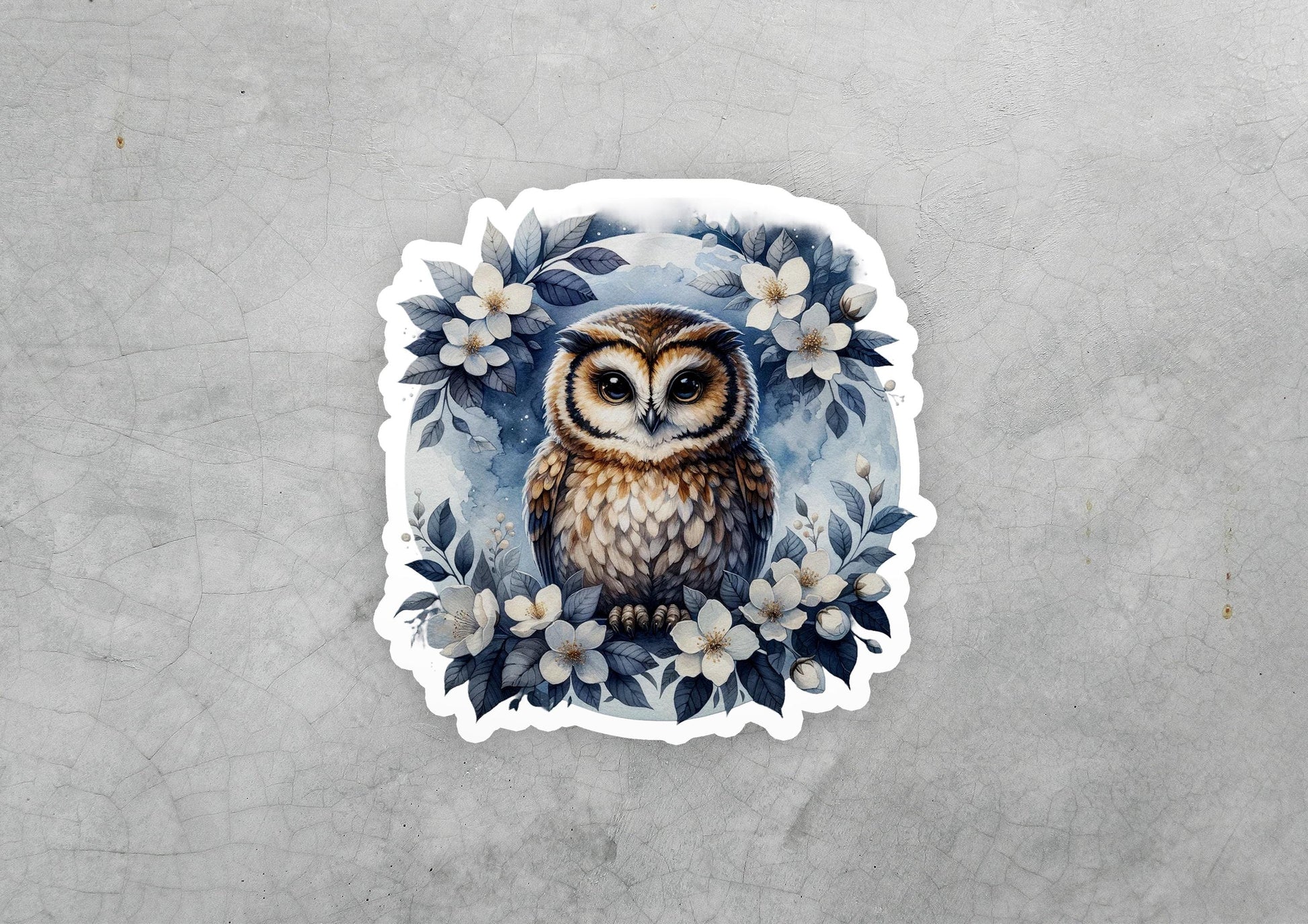 a sticker of an owl surrounded by flowers