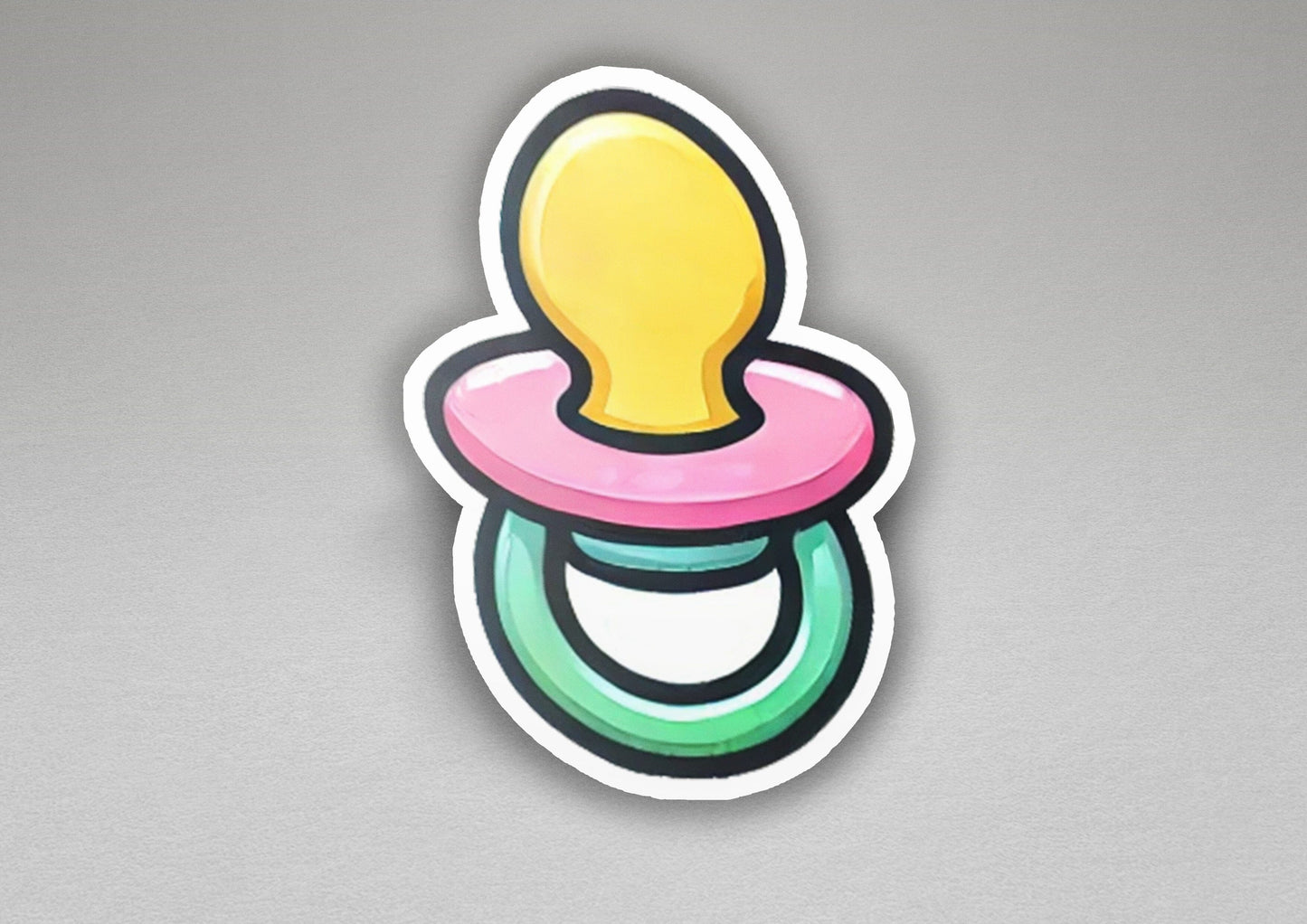 a sticker of a pacifier on a gray background