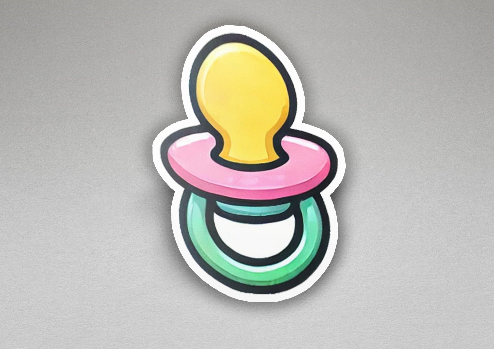 a sticker of a pacifier on a gray background