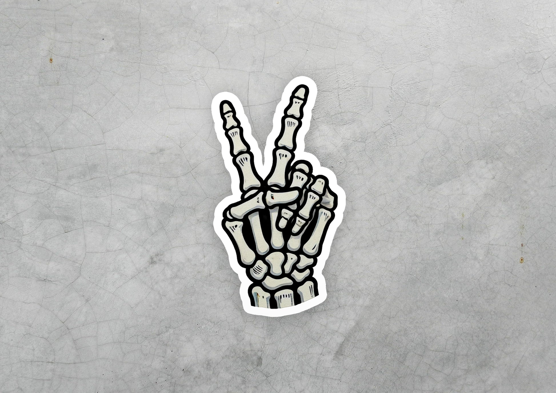a sticker of a hand making the peace sign
