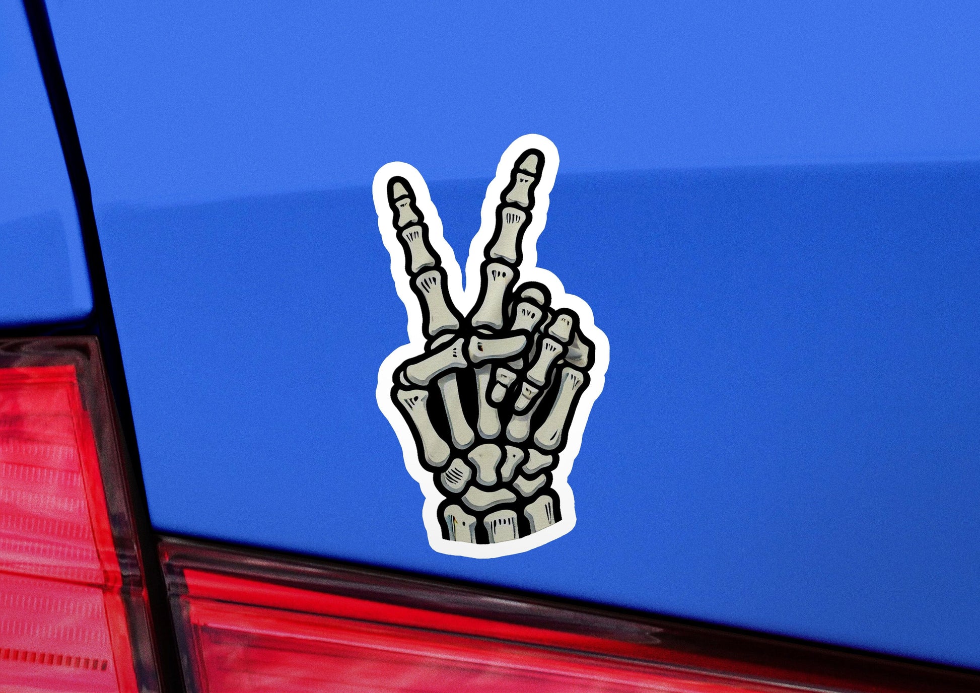 a sticker of a peace sign on the back of a car