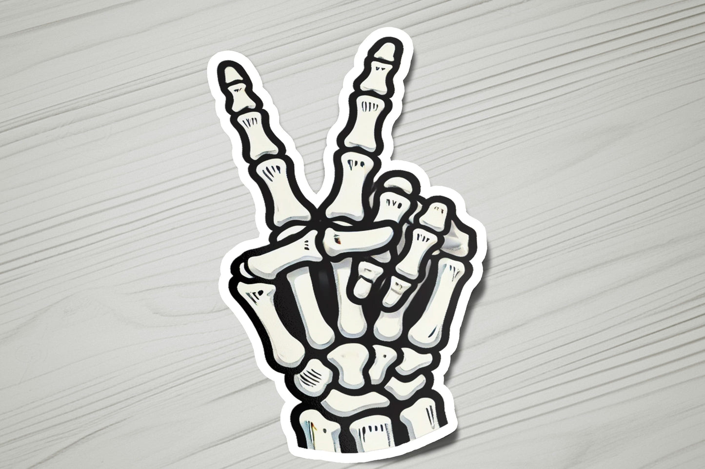 a sticker of a hand making the peace sign