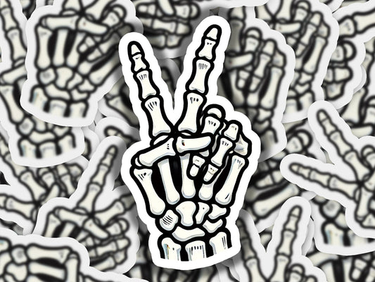 a sticker of a hand making a peace sign