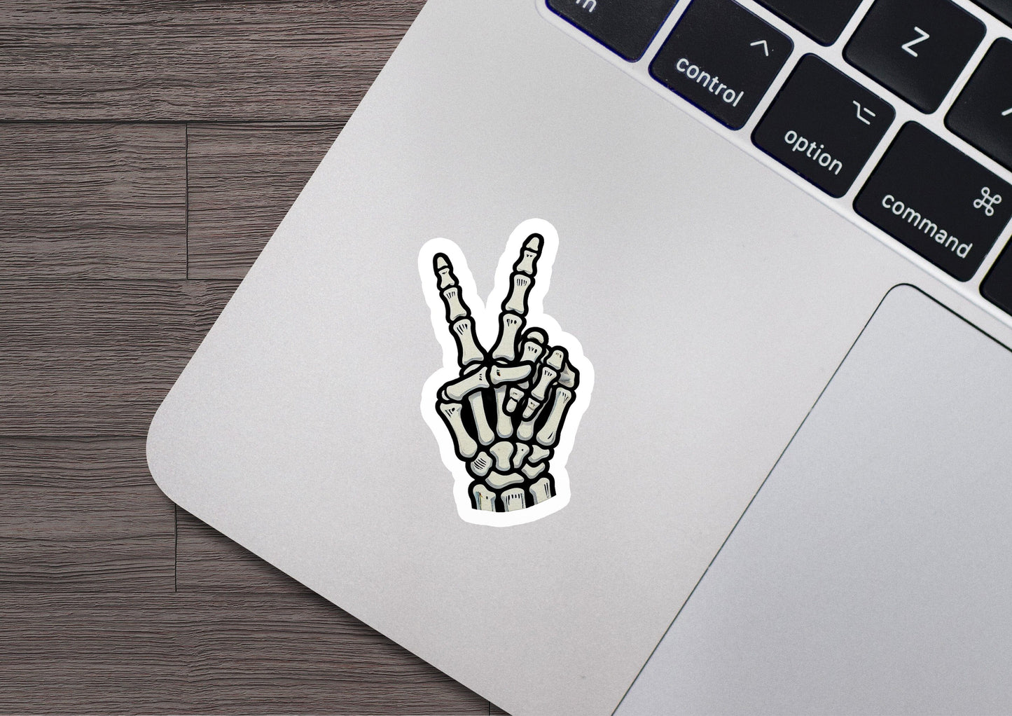 a laptop with a sticker of a peace sign