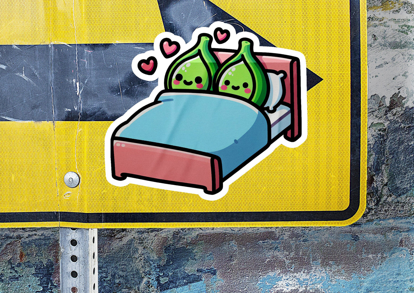 a sticker of a bed with two pillows on it