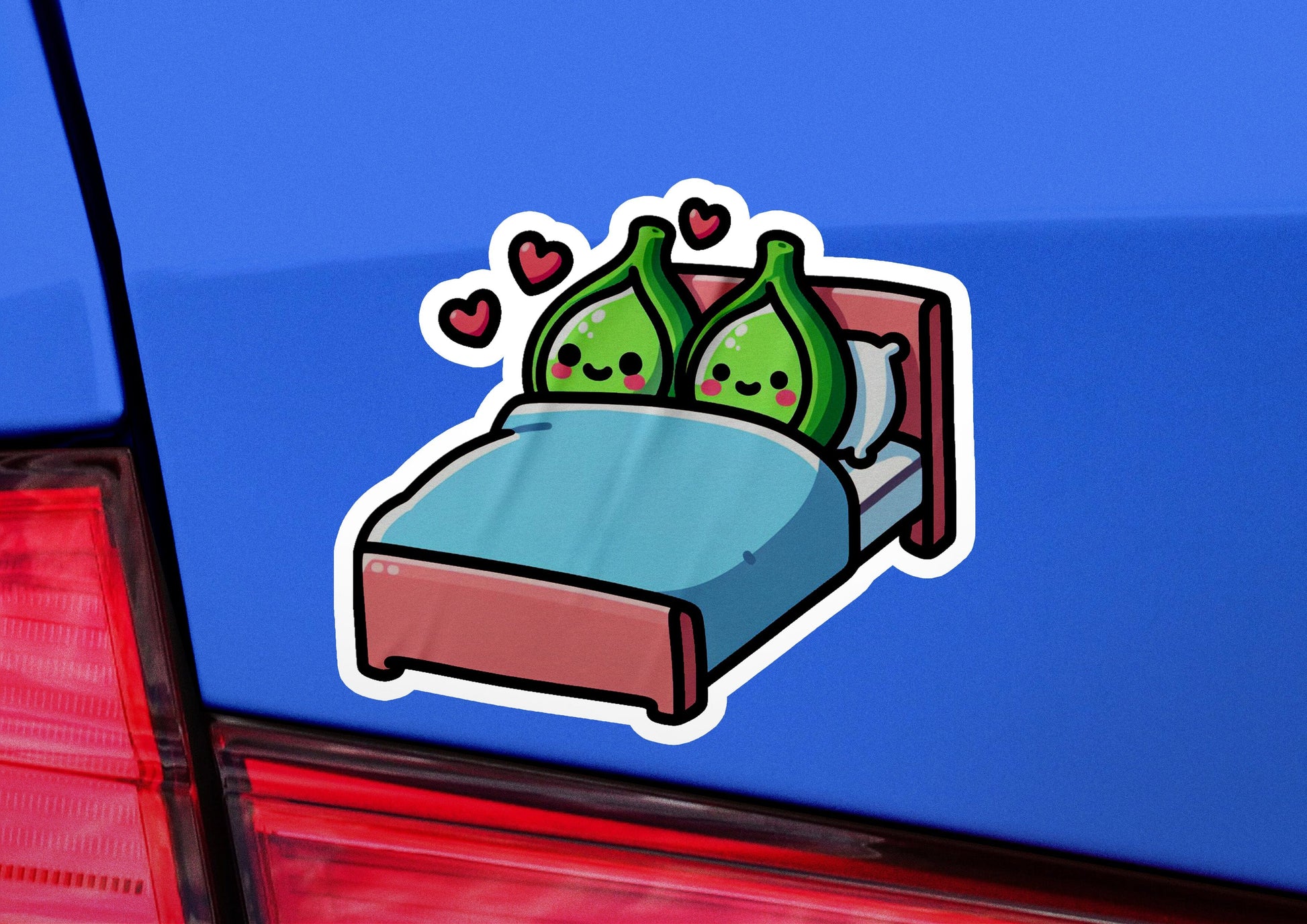 a sticker of a bed with two pillows on it