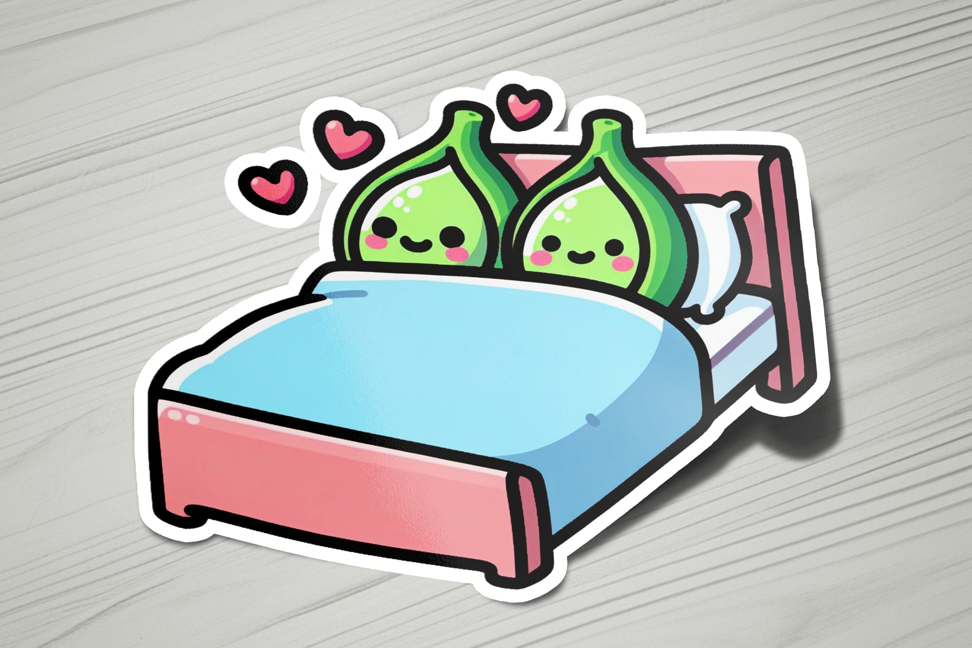 a sticker of a bed with two green pillows