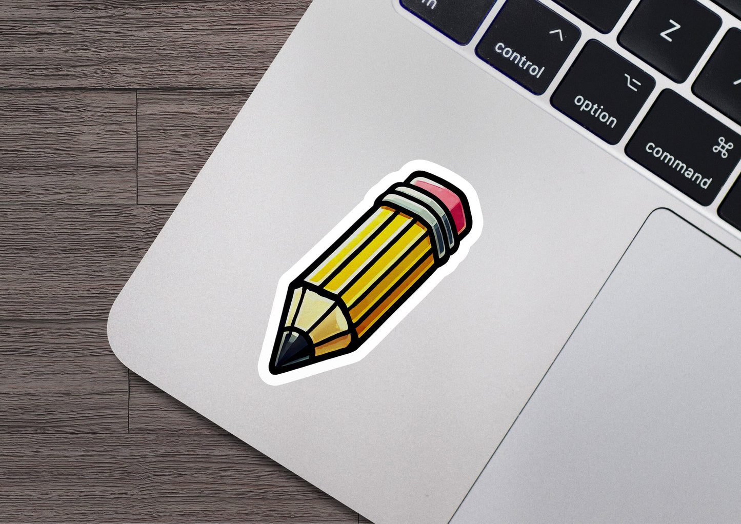 a sticker of a pencil on a laptop