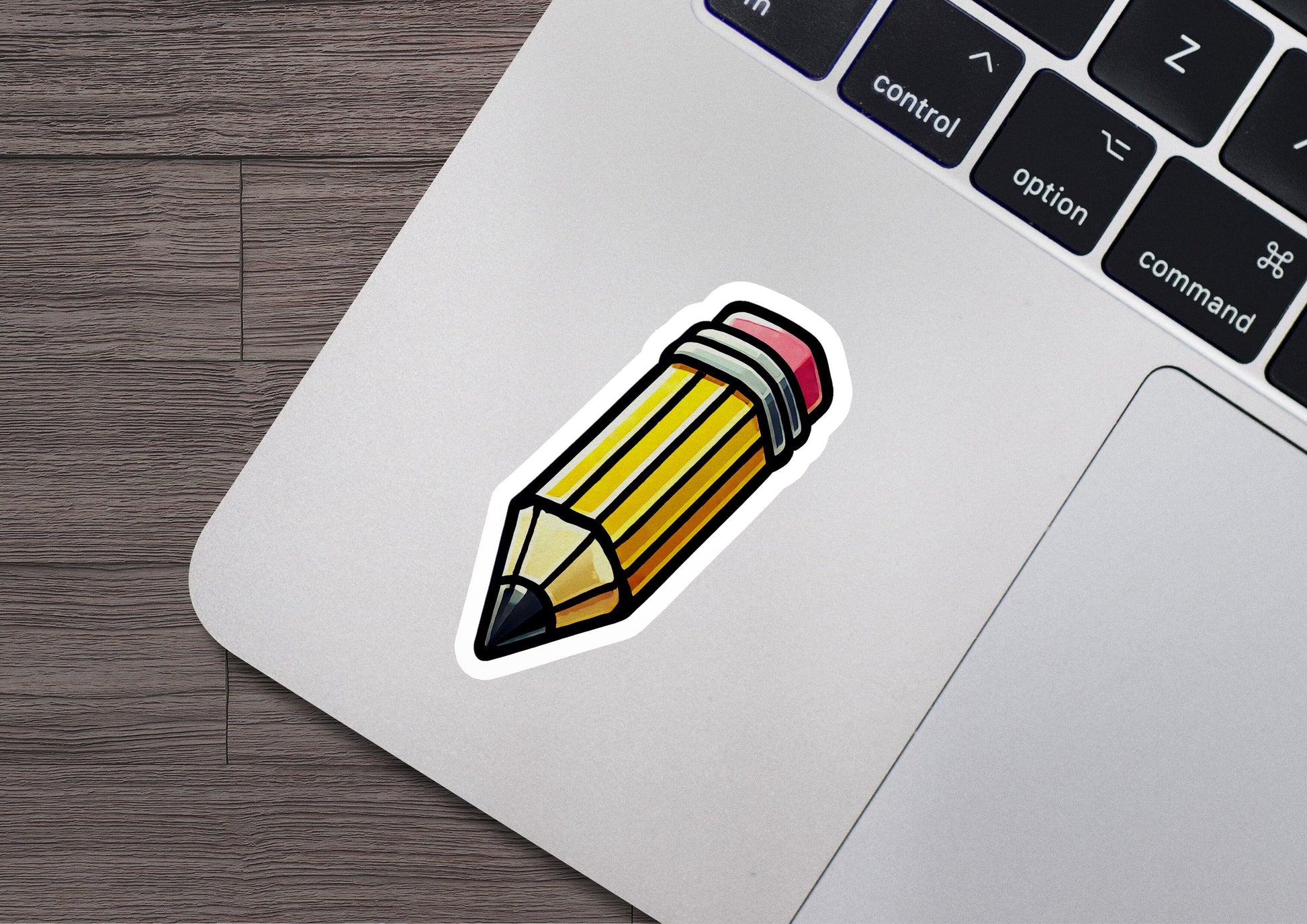 a sticker of a pencil on a laptop
